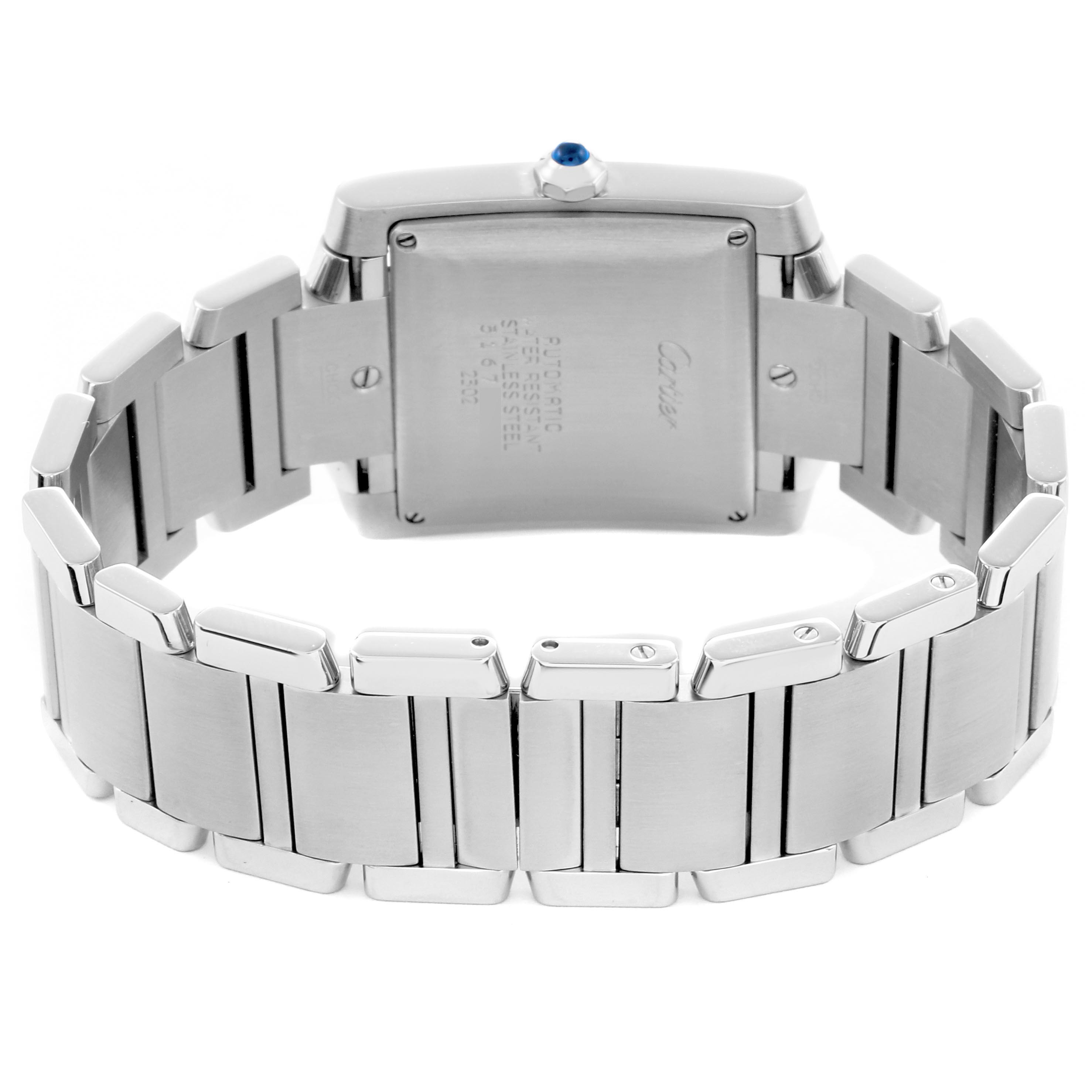 The image shows the back of a Cartier Tank Française watch, focusing on the case back and stainless steel bracelet.