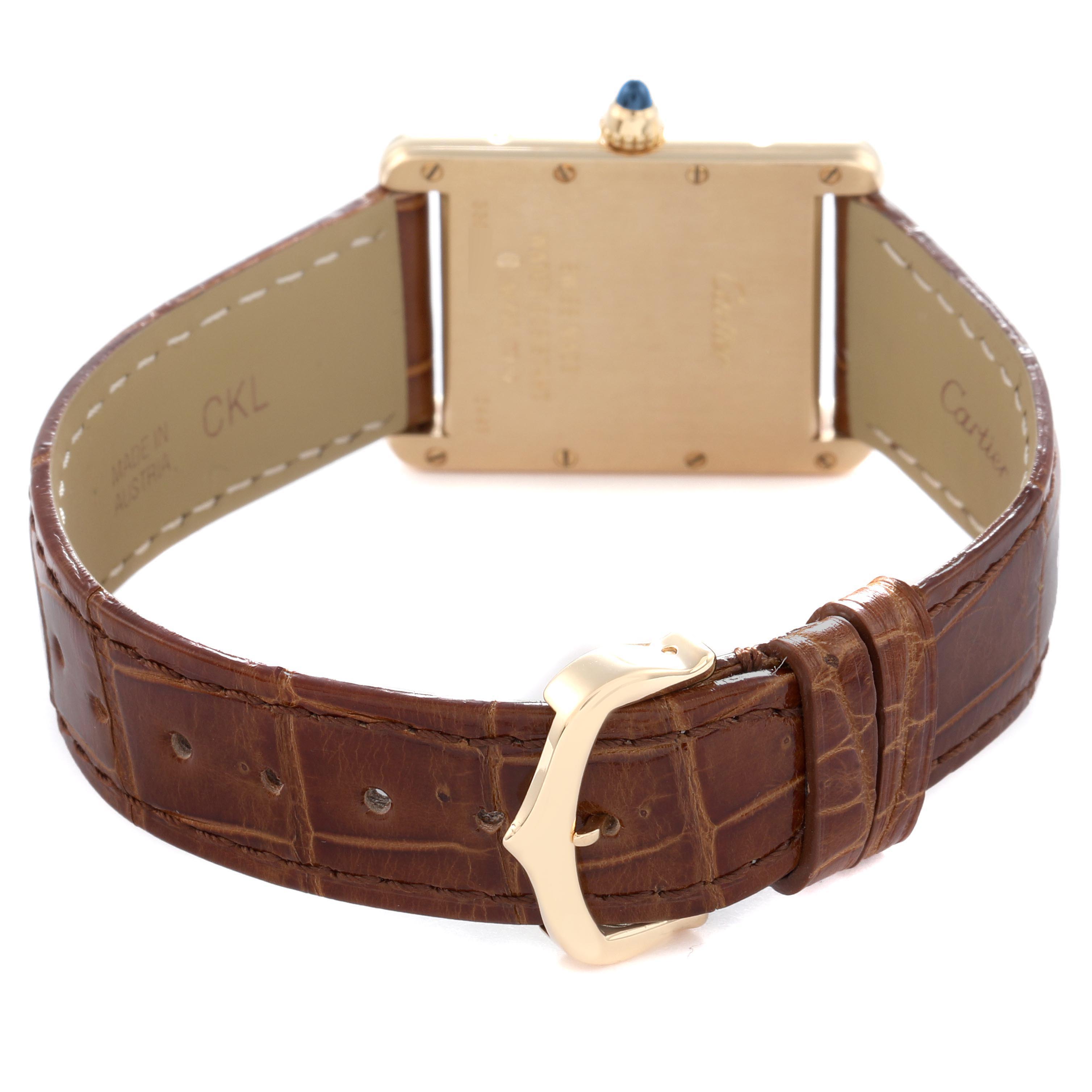 The image shows the back and side view of a Cartier Tank Louis W1529756 Men
s Yellow Gold Silver Dial W1529756 Men
s Yellow Gold Silver Dial watch, highlighting the gold case and brown leather strap with buckle.