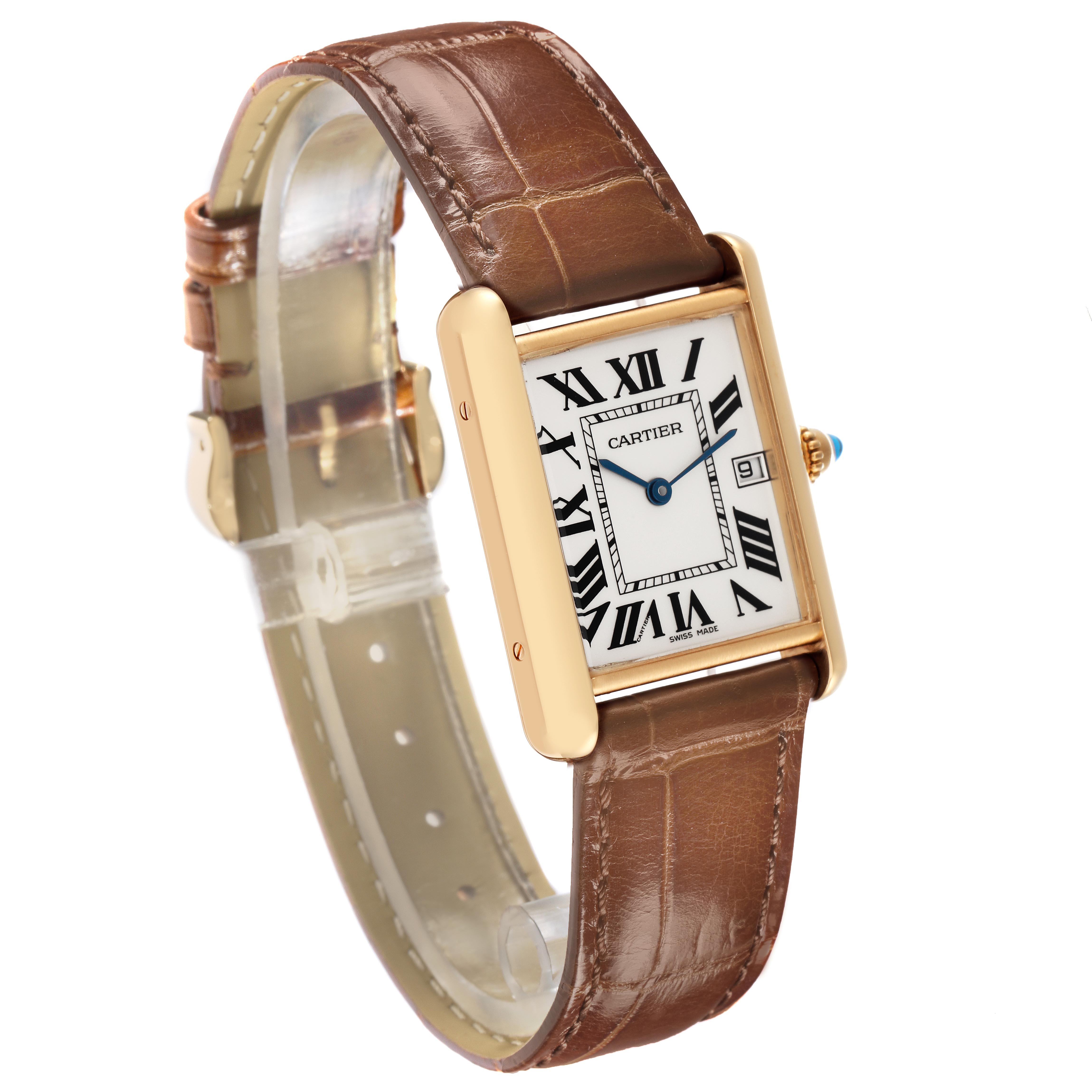 The Cartier Tank Louis W1529756 Men
s Yellow Gold Silver Dial W1529756 Men
s Yellow Gold Silver Dial watch is shown at a three-quarter angle, displaying the face, strap, and side, including the crown with a blue gem.