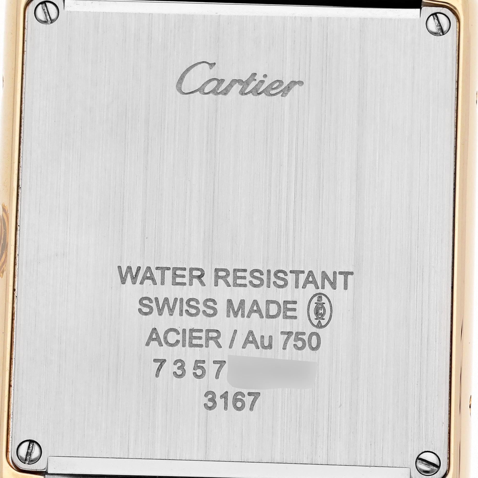 The image shows the back case of a Cartier Tank Solo W5200004 Men
s Steel and Gold (two tone) Silver Dial W5200004 Men
s Steel and Gold (two tone) Silver Dial watch, featuring engraved details and screws at the corners.