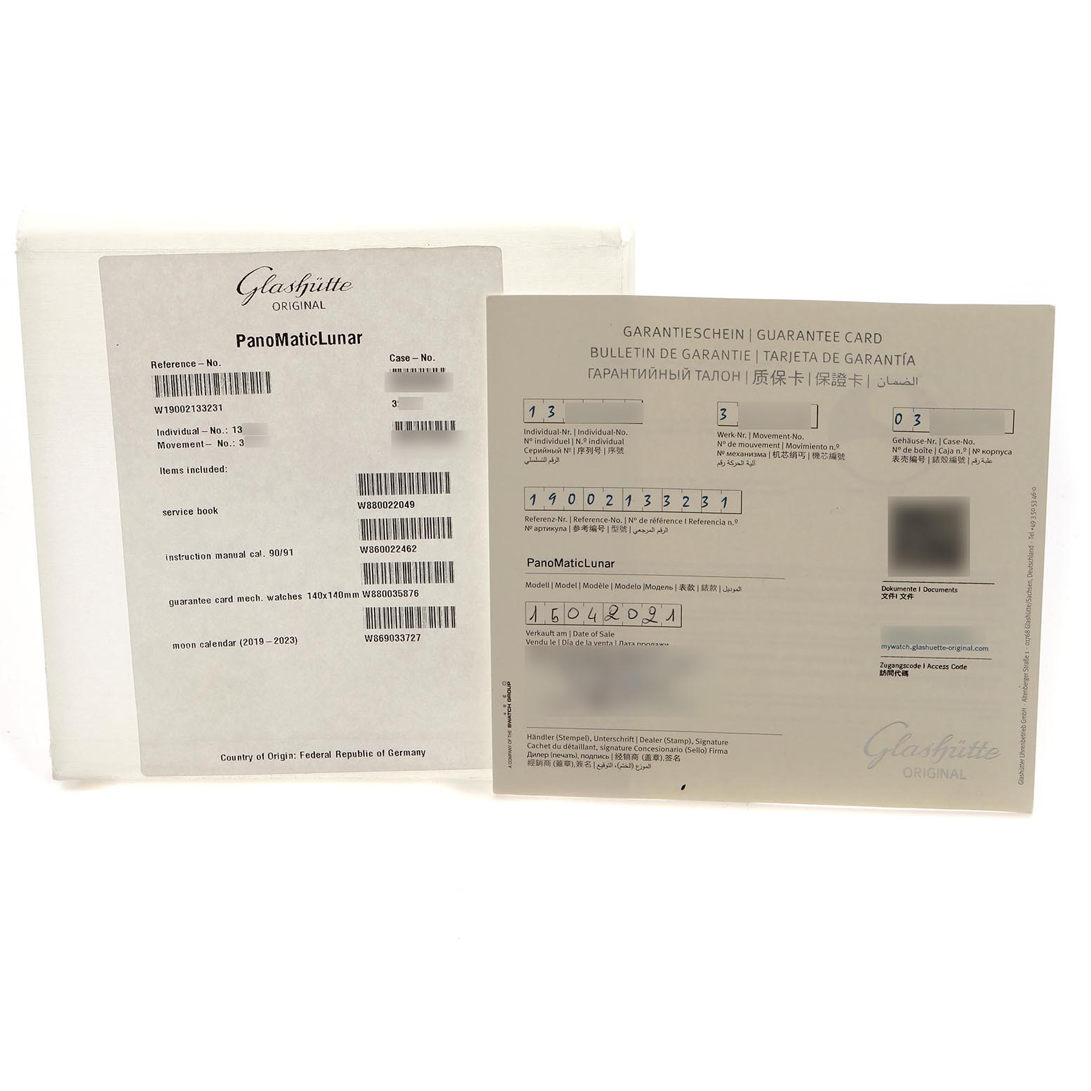 The image shows the packaging and guarantee card for a Glashütte PanoMaticLunar watch, viewed from above.