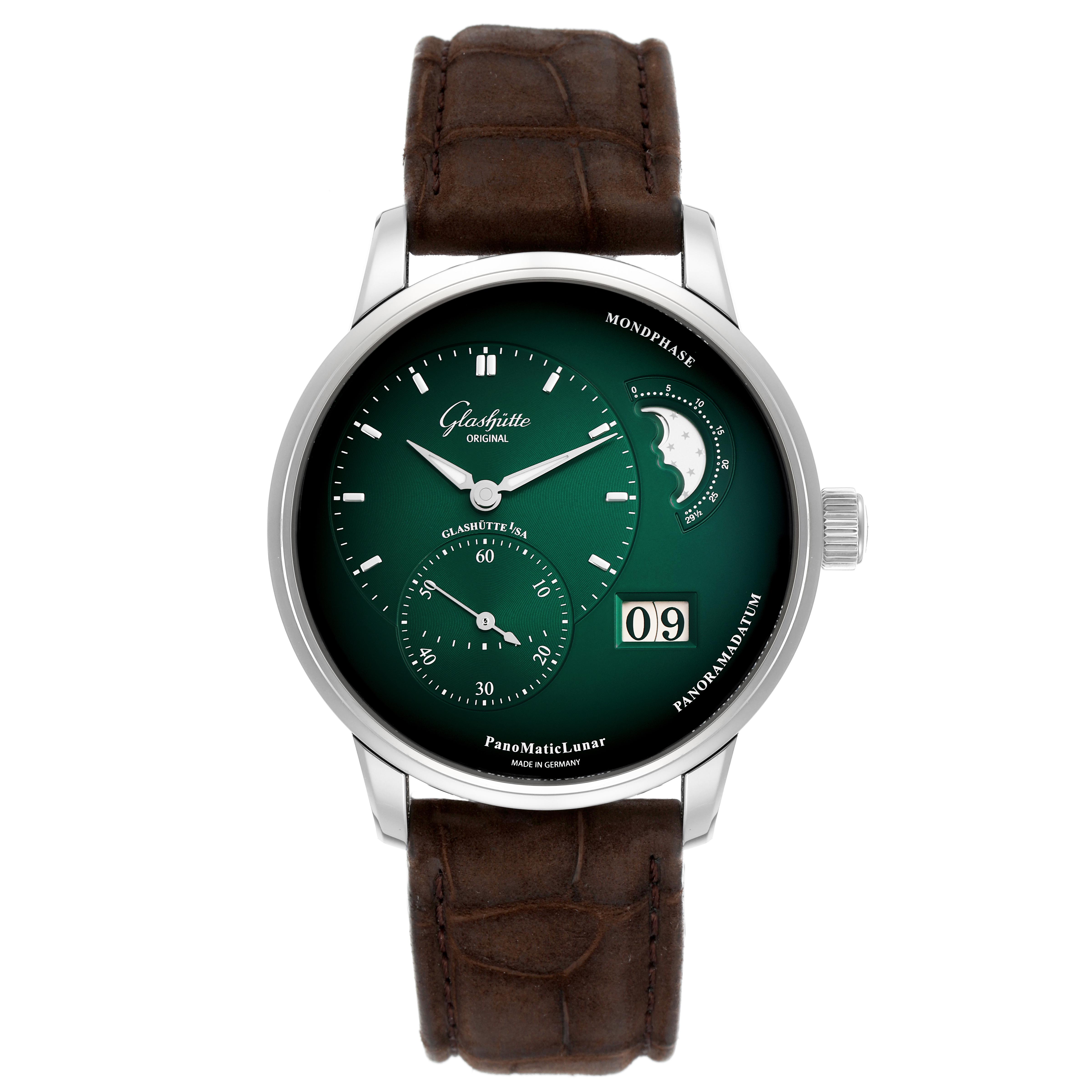 The Glashütte Pano watch is shown from the front, displaying its dial, moon phase, and brown leather strap.
