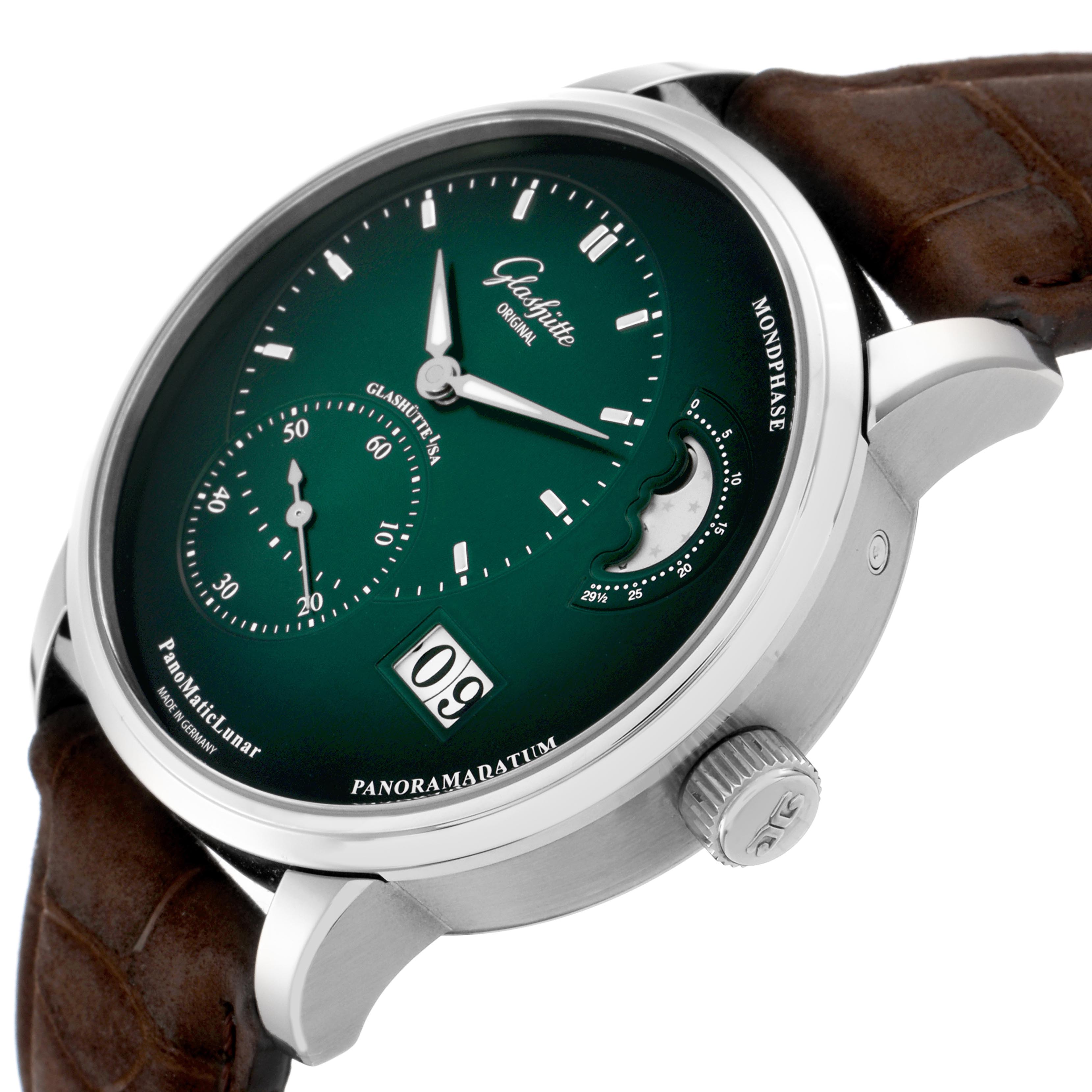 The Glashütte Pano watch is shown at a slight side angle, displaying the dial, crown, and part of the strap.