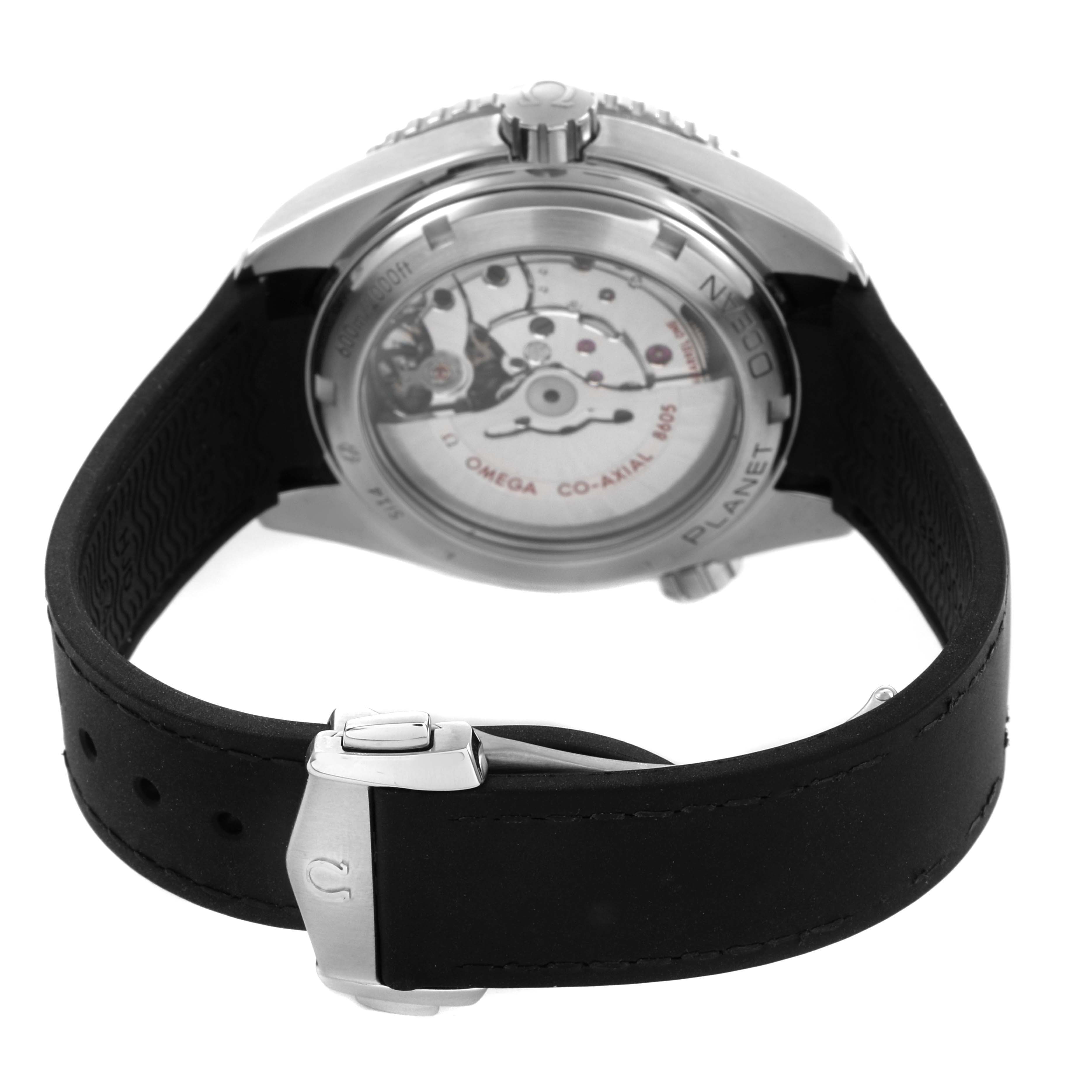 The image shows the back of the Omega Planet Ocean 232.32.44.22.01.001 Mens Stainless Steel Black Dial watch, featuring the case back, movement details, and strap clasp.