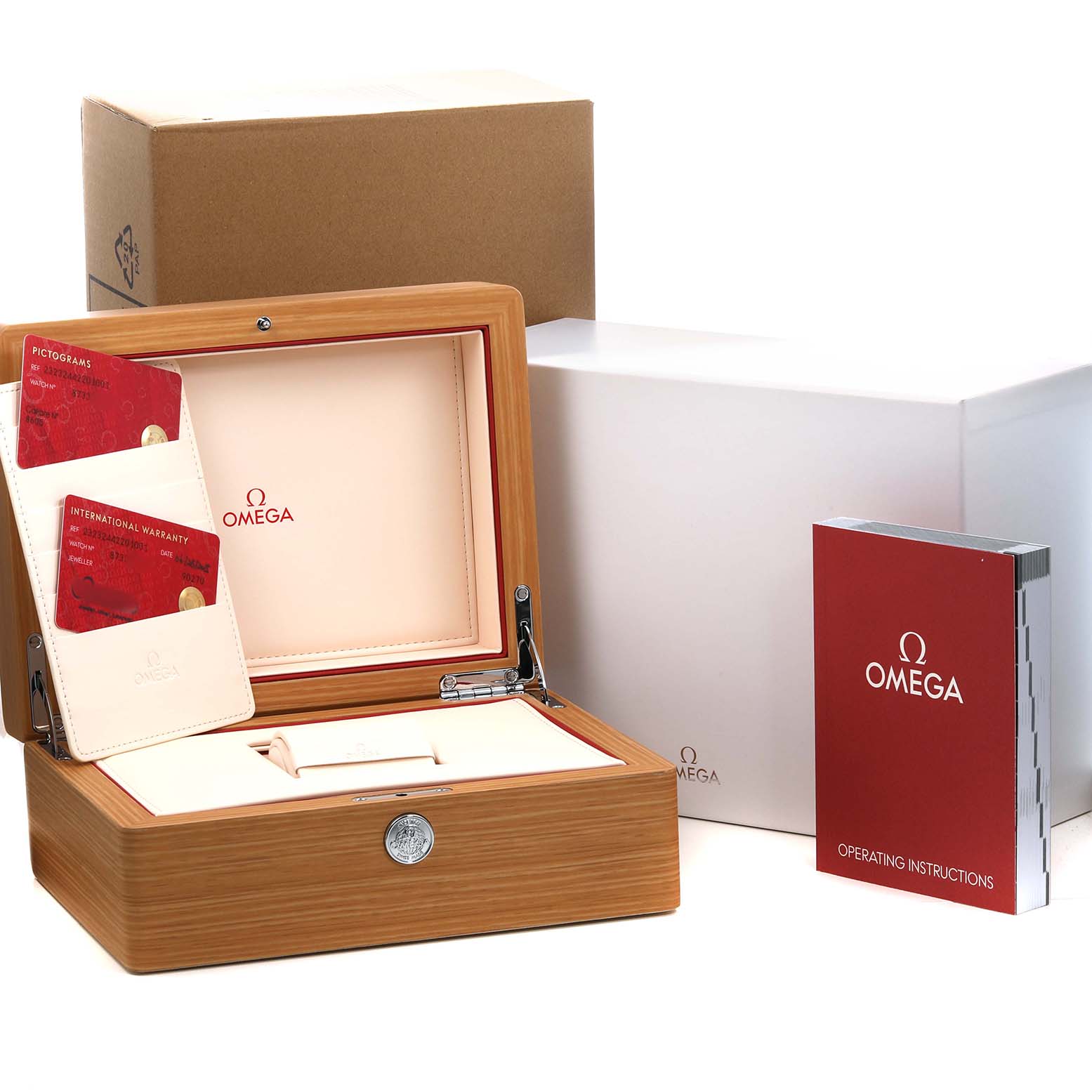 The image shows an open Omega Planet Ocean 232.32.44.22.01.001 Mens Stainless Steel Black Dial watch box with manuals and warranty cards, viewed from the front.