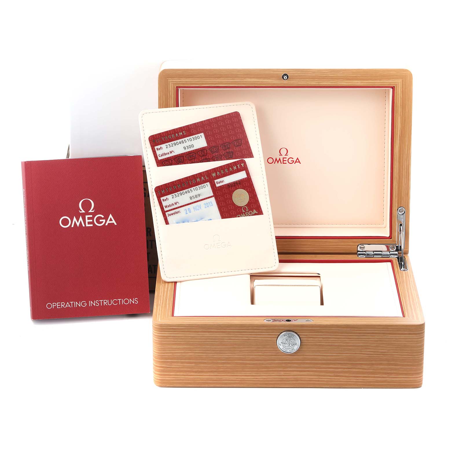 The image shows the packaging and accessories for the Omega Planet Ocean 232.90.46.51.03.001 Men
s Stainless Steel Blue Dial 232.90.46.51.03.001 Men
s Stainless Steel Blue Dial, including a box, cards, and an instruction booklet.