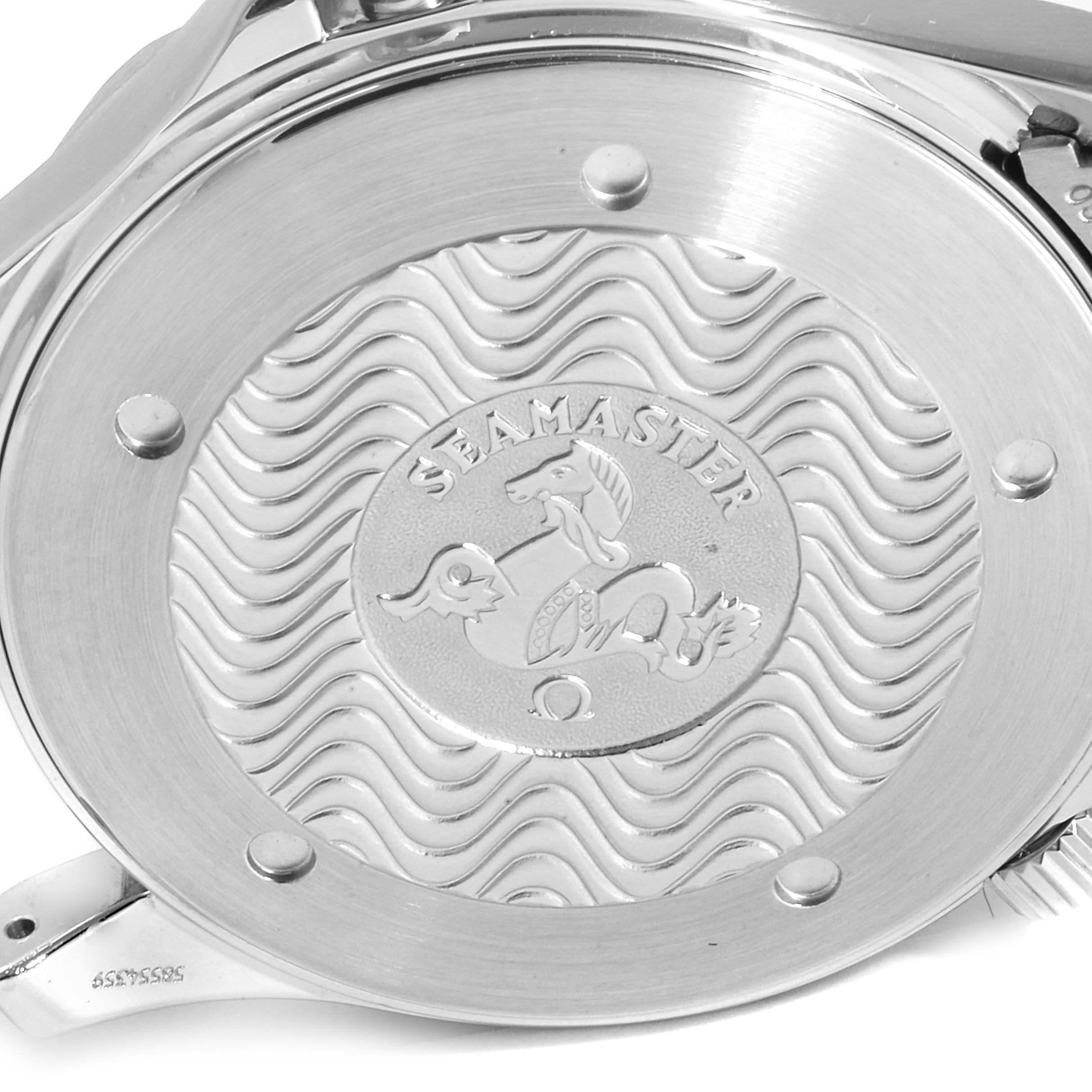 The image shows the back case of an Omega Seamaster 2264.50.00 Men
s Stainless Steel Black Dial 2264.50.00 Men
s Stainless Steel Black Dial watch, featuring its engraved logo and wave pattern design.