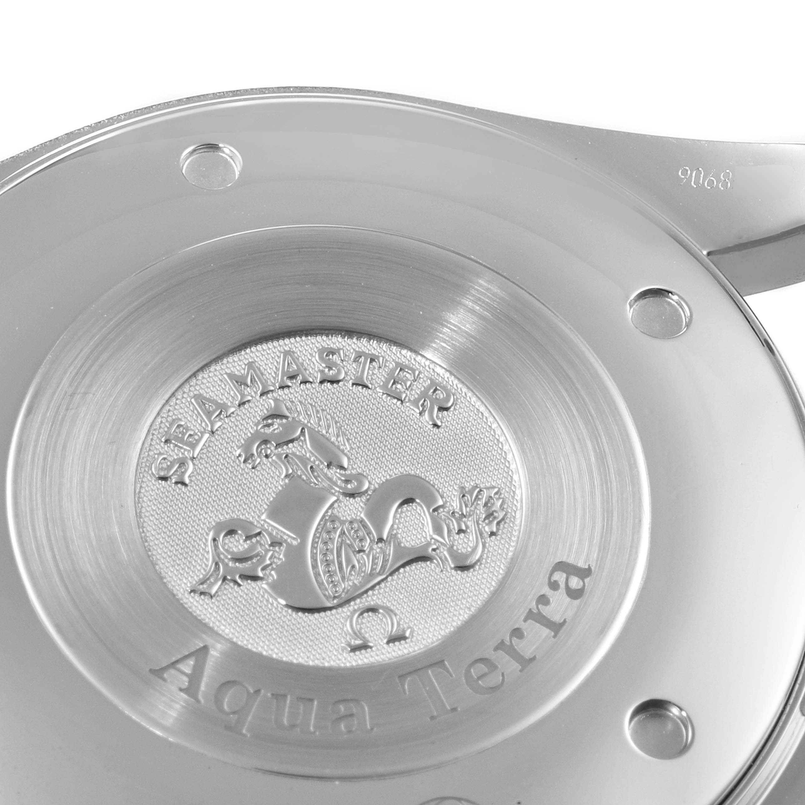 This image shows the case back of the Omega Seamaster Aqua Terra watch, featuring its engraved emblem.