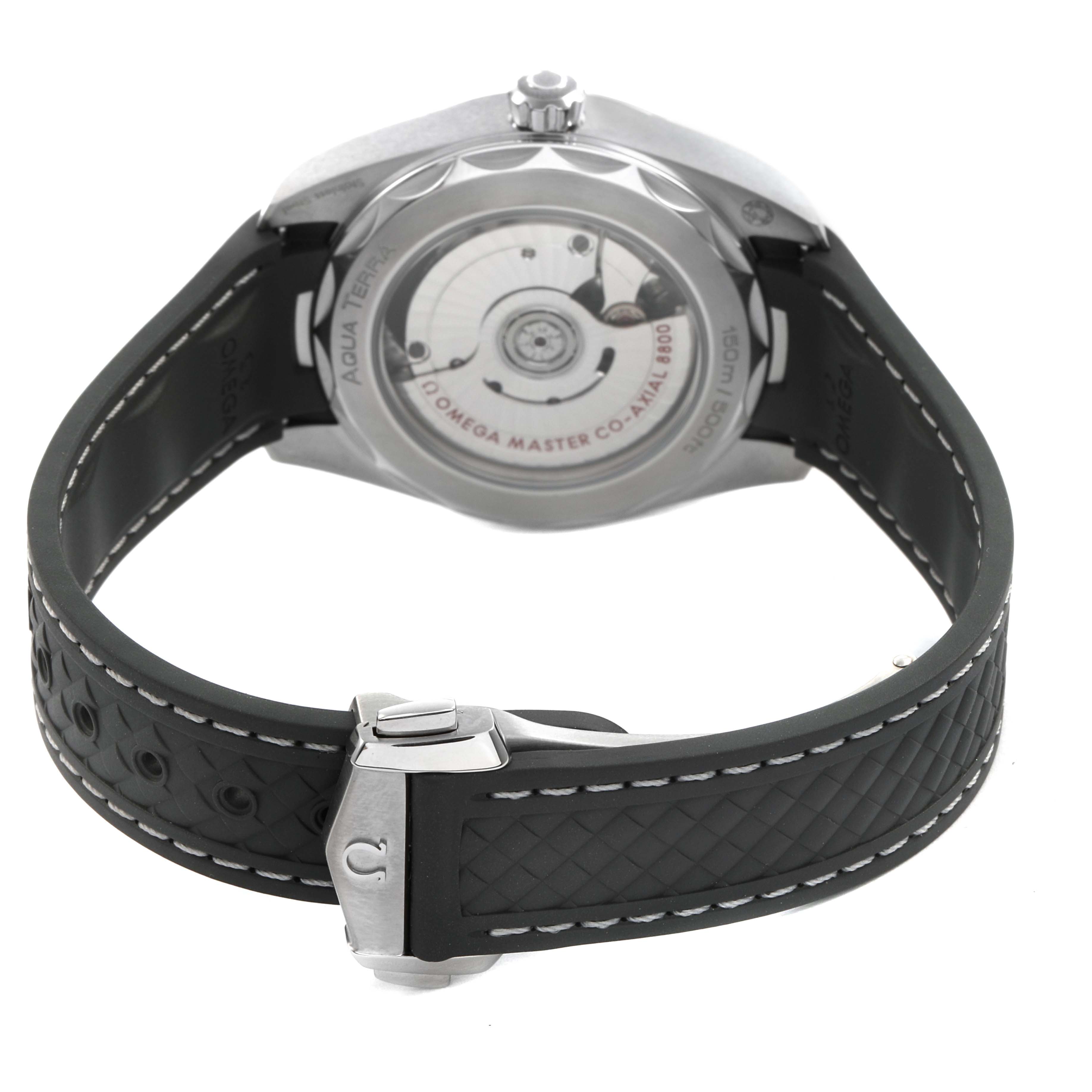 The image shows the back of an Omega Aqua Terra 220.12.38.20.02.001 Men's Stainless Steel Silver Dial watch, revealing the movement and rubber strap with clasp.