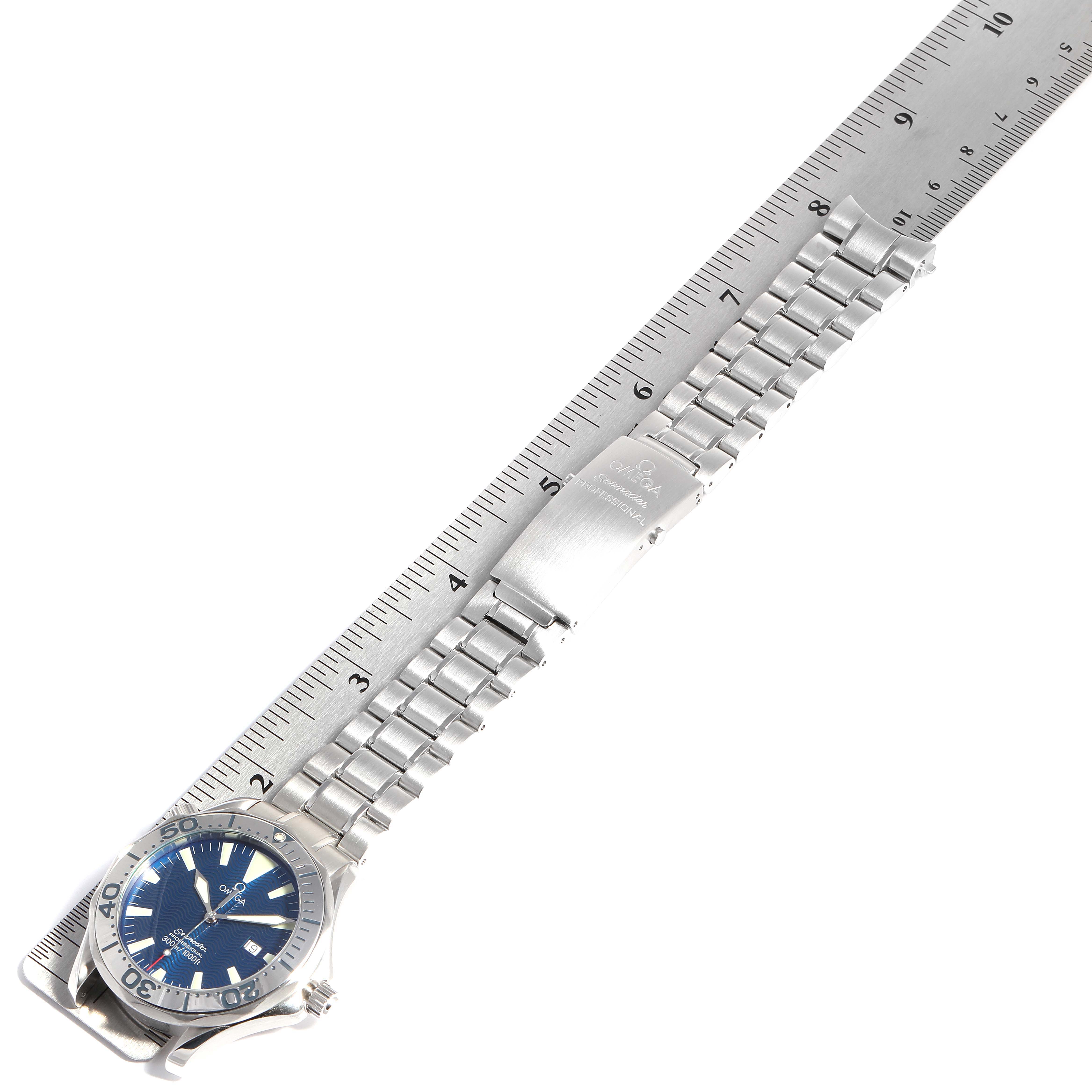 This image shows an Omega Seamaster 2265.80.00 Men
s Stainless Steel Blue Dial 2265.80.00 Men
s Stainless Steel Blue Dial watch laid flat with its full bracelet measured against a ruler.