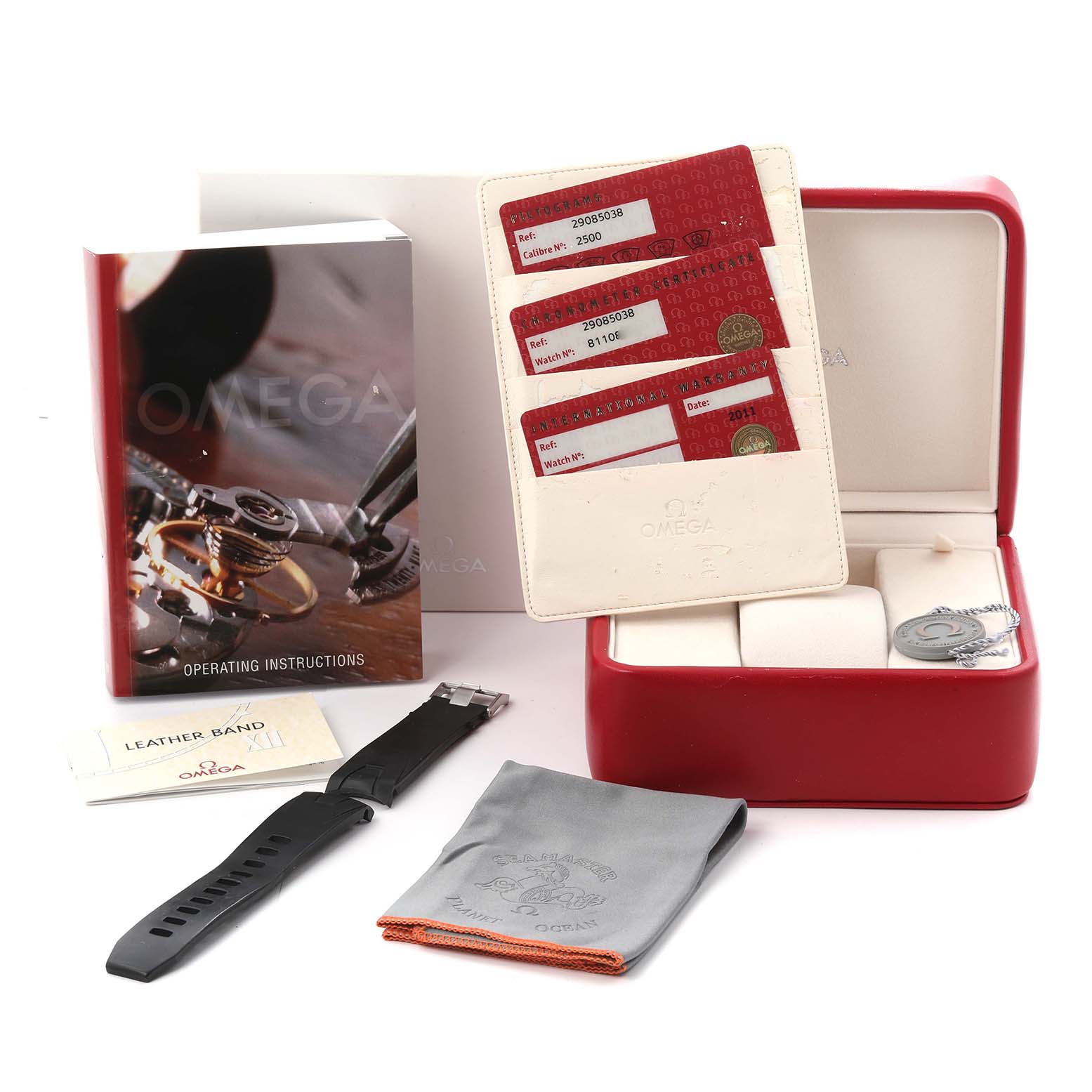 The image shows Omega Planet Ocean 2908.50.38 Men
s Stainless Steel Black Dial 2908.50.38 Men
s Stainless Steel Black Dial accessories including a box, extra strap, cloth, manual, and warranty cards from a front angle.