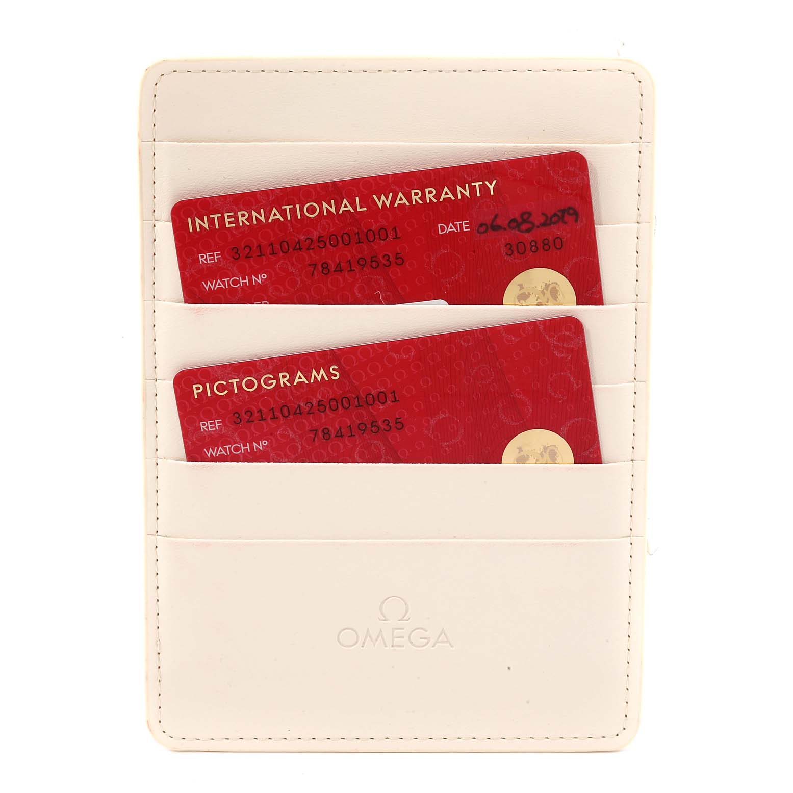 The image shows the warranty and pictogram cards in a white Omega cardholder for the Omega Speedmaster 321.10.42.50.01.001 Men
s Stainless Steel Black Dial 321.10.42.50.01.001 Men
s Stainless Steel Black Dial watch.