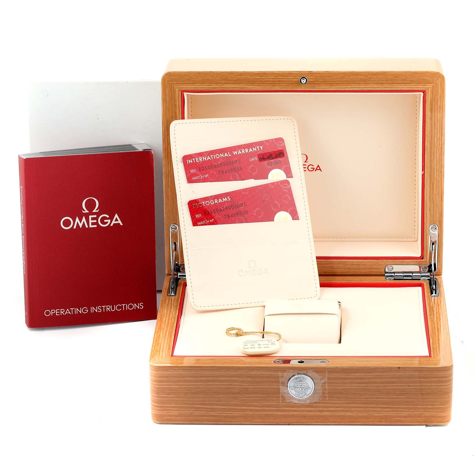 The image shows an Omega Speedmaster 321.10.42.50.01.001 Men
s Stainless Steel Black Dial 321.10.42.50.01.001 Men
s Stainless Steel Black Dial box with warranty cards, operating instructions, and a wooden watch case.