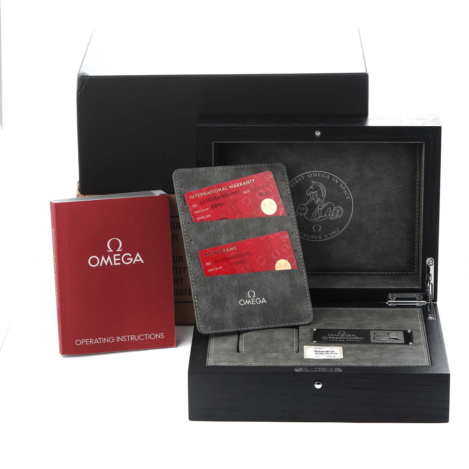 The image shows the Omega Speedmaster 311.32.40.30.01.001 Men
s Stainless Steel Black Dial 311.32.40.30.01.001 Men
s Stainless Steel Black Dial
s packaging, warranty cards, instruction manual, and display box.