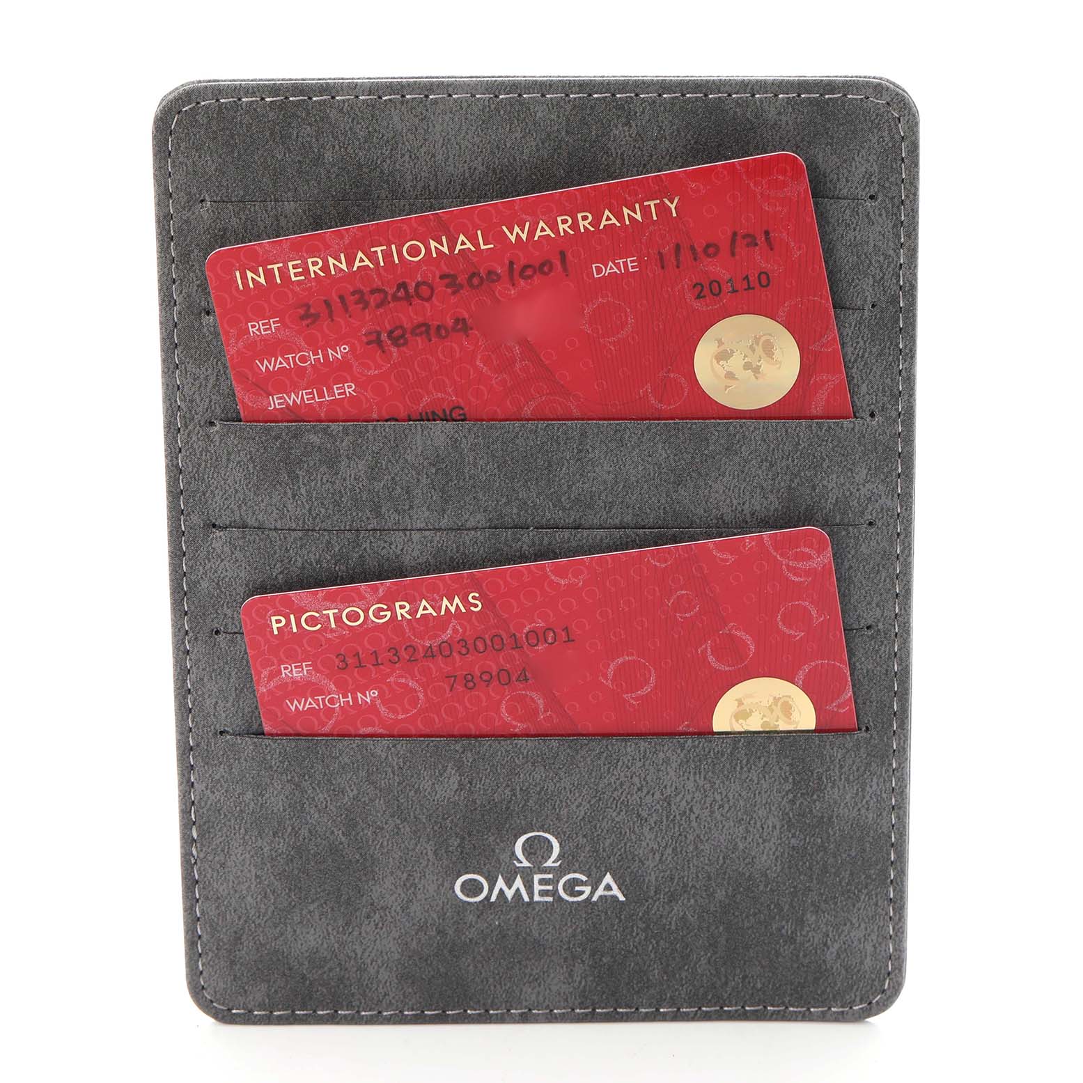 The image shows Omega Speedmaster 311.32.40.30.01.001 Men
s Stainless Steel Black Dial 311.32.40.30.01.001 Men
s Stainless Steel Black Dial watch warranty and pictogram cards in a branded holder.