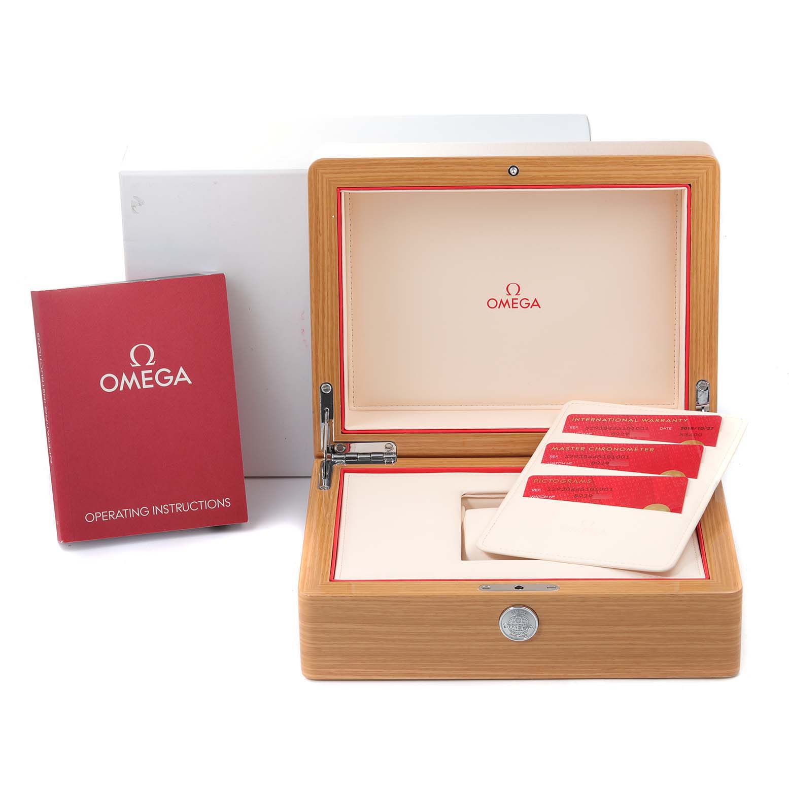 The image shows the open box and accessories of an Omega Speedmaster 329.30.44.51.01.001 Men
s Stainless Steel Black Dial 329.30.44.51.01.001 Men
s Stainless Steel Black Dial watch, including the operating instructions and warranty cards.