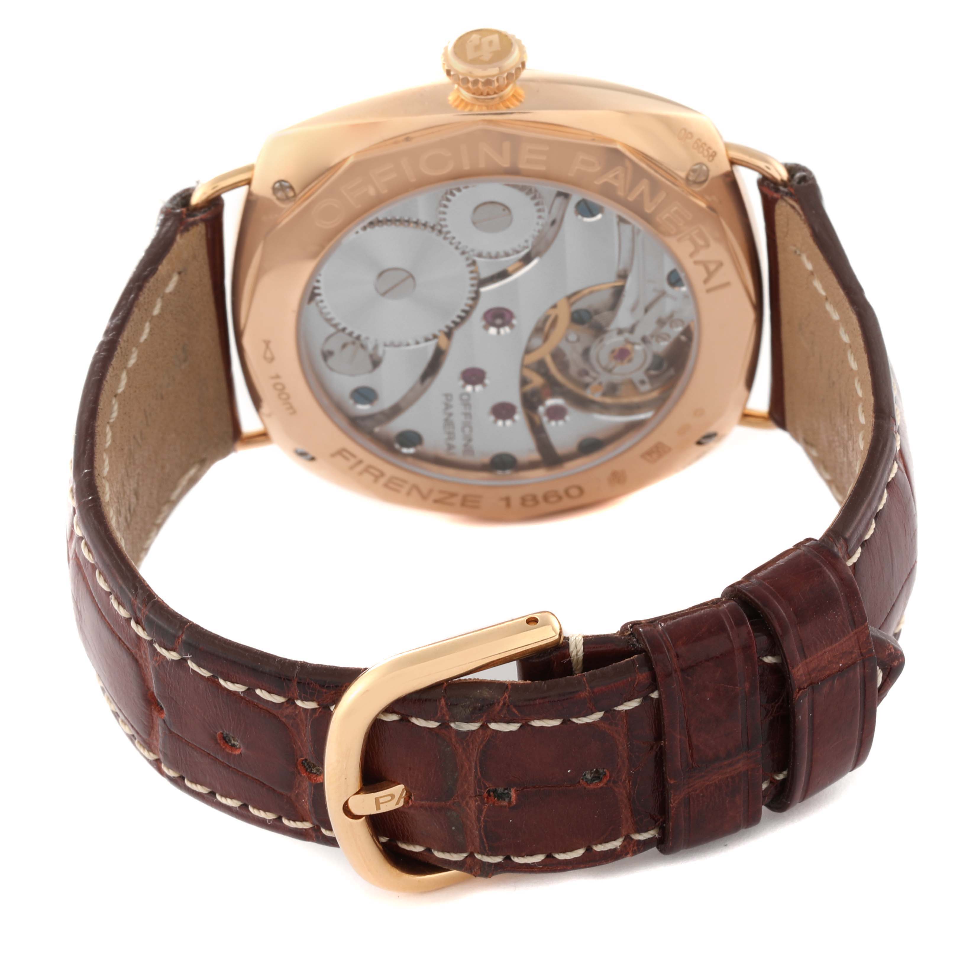 The image shows the back angle of a Panerai Radiomir PAM00231 Men's Rose Gold Black Dial PAM00231 Men's Rose Gold Black Dial watch, highlighting its exposed mechanical movement and leather strap with a buckle.