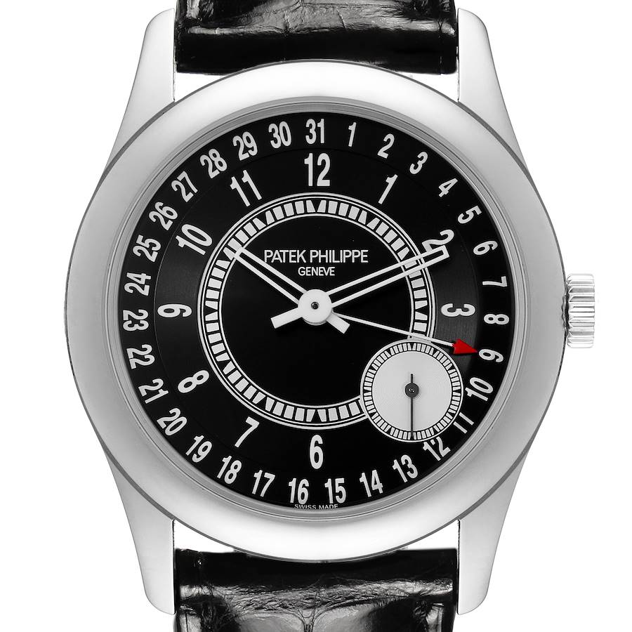 The Patek Philippe Calatrava watch is shown from a top-down angle, displaying the dial, hands, numbers, and part of the strap.