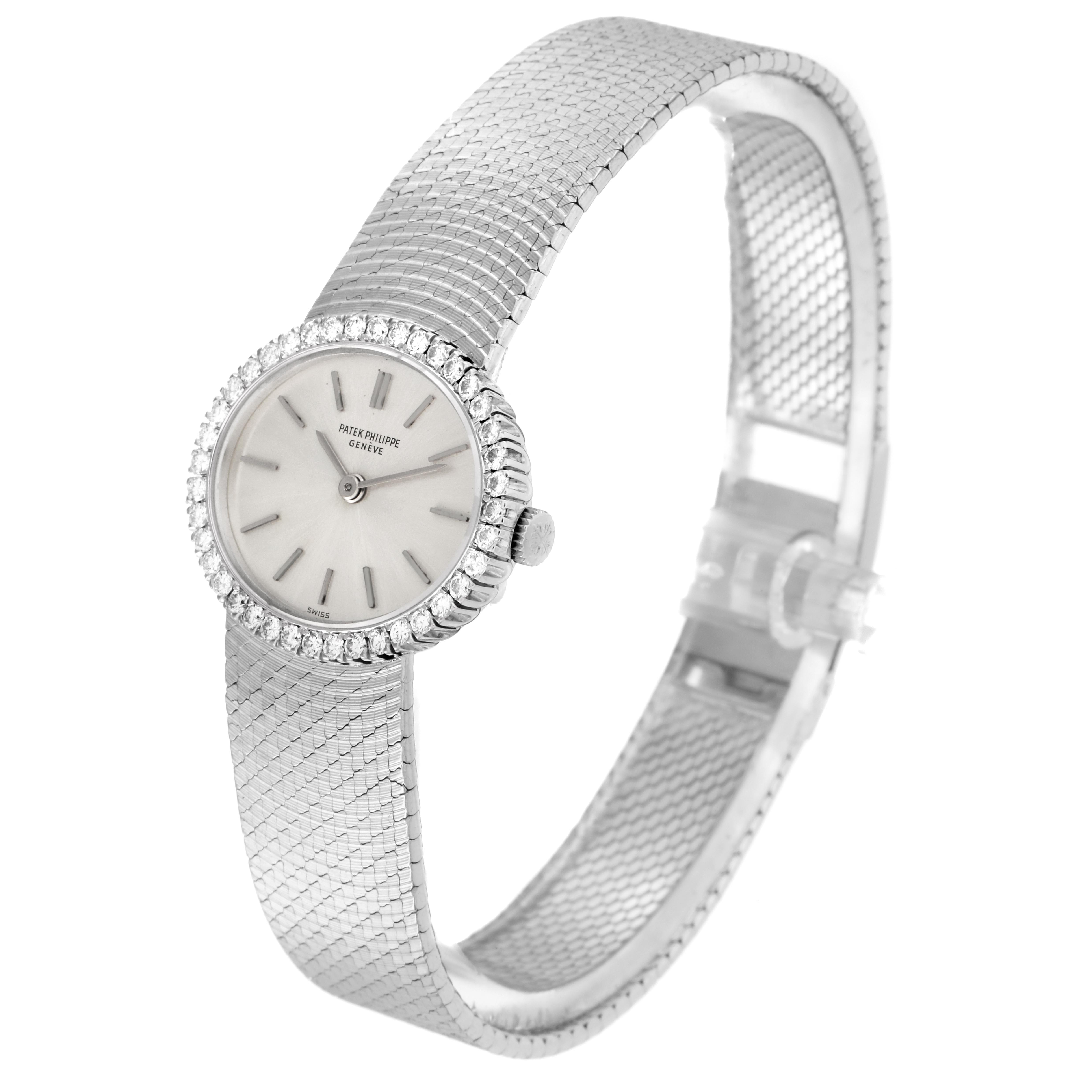 The Patek Philippe Golden Ellipse 3350 Women
s White Gold Silver Dial 3350 Women
s White Gold Silver Dial watch is shown at an angle highlighting the face, bezel, crown, and full bracelet.