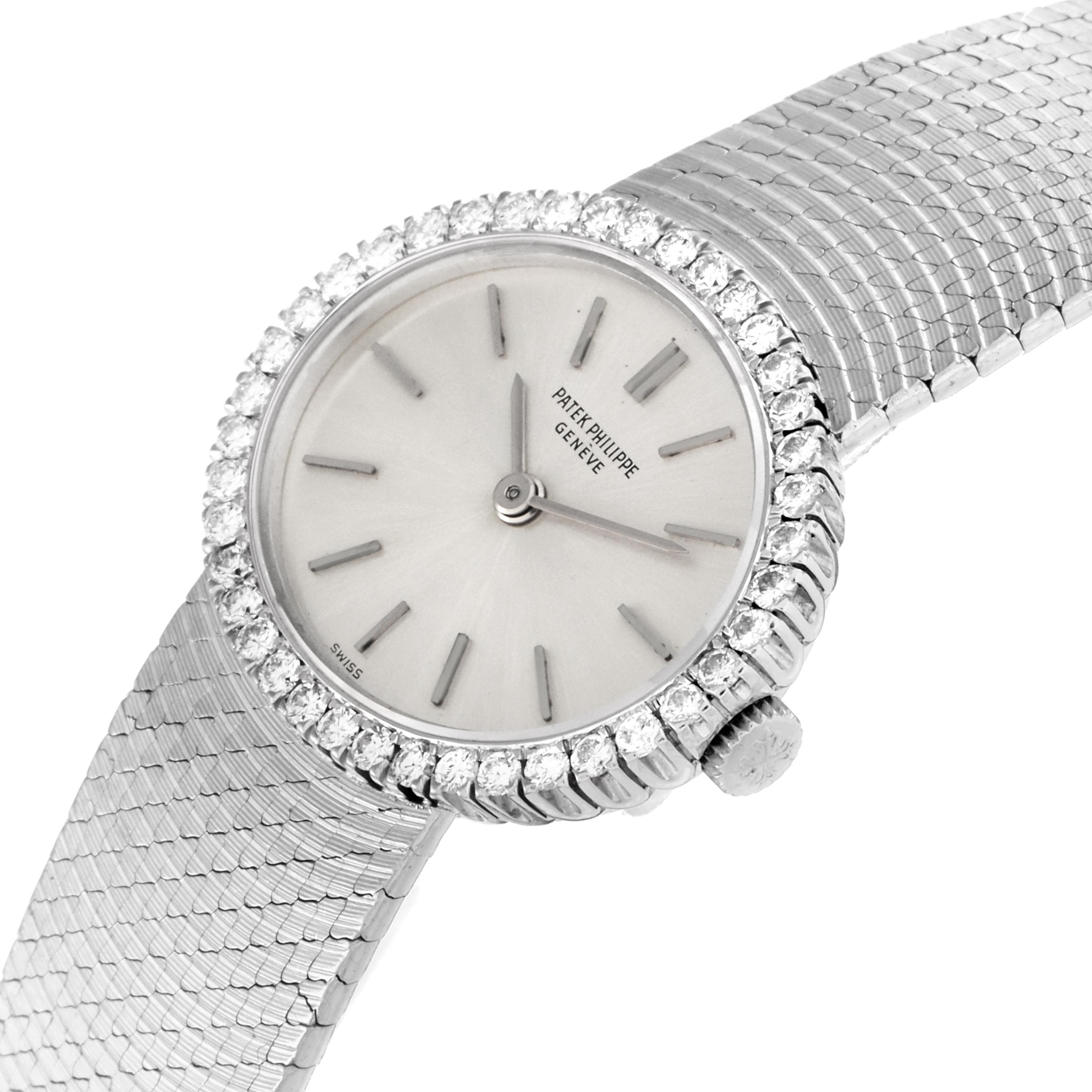 The image shows a Patek Philippe Golden Ellipse 3350 Women
s White Gold Silver Dial 3350 Women
s White Gold Silver Dial watch at a tilted angle, highlighting the diamond bezel, dial, and textured bracelet.