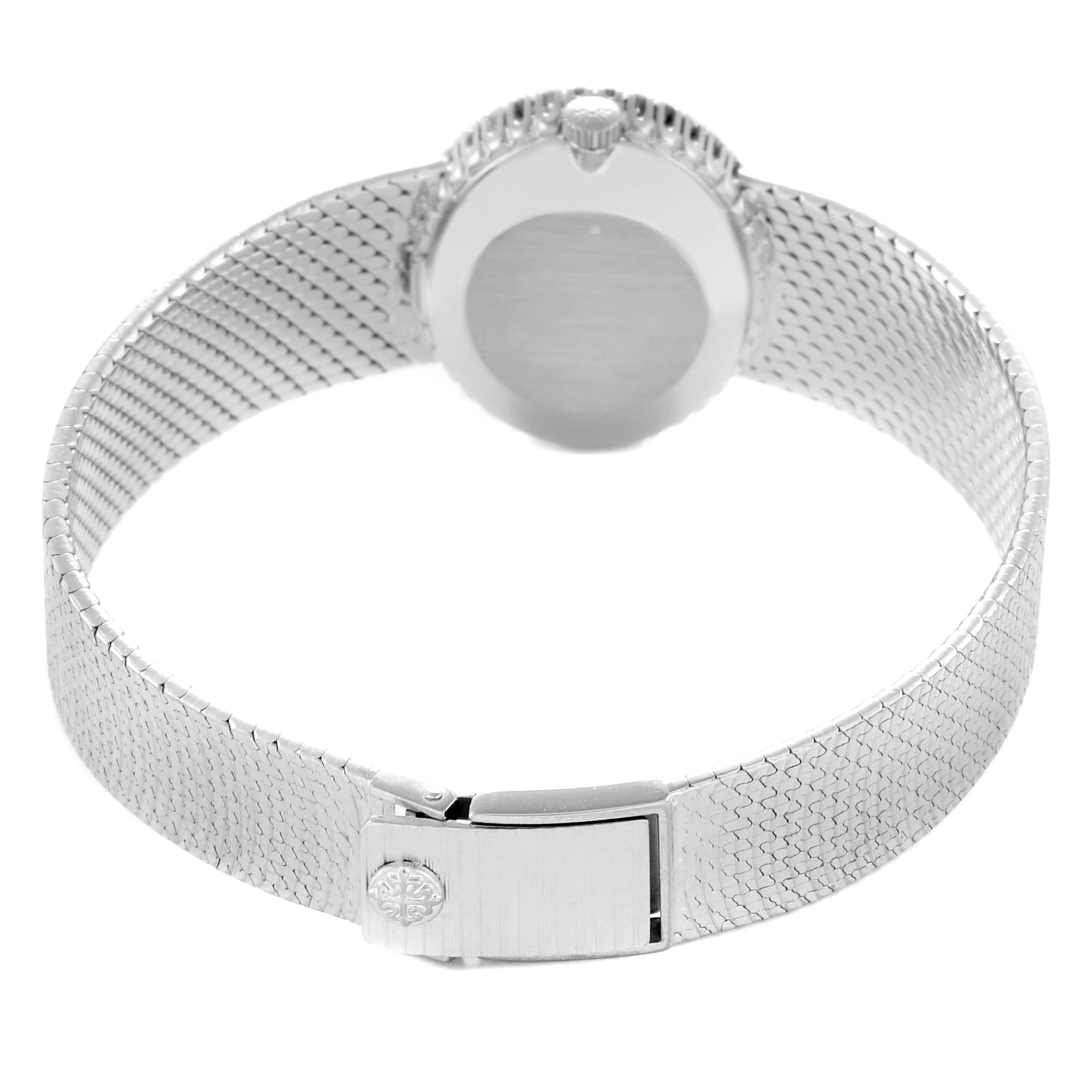 The image shows the back and clasp of the Patek Philippe Golden Ellipse 3350 Women
s White Gold Silver Dial 3350 Women
s White Gold Silver Dial watch, highlighting its mesh bracelet and crown.