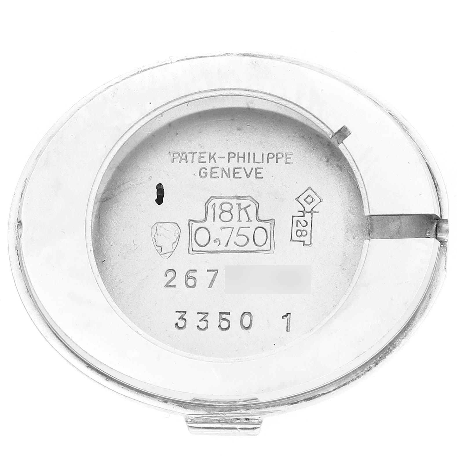 The image shows the back case of a Patek Philippe Golden Ellipse 3350 Women
s White Gold Silver Dial 3350 Women
s White Gold Silver Dial watch, displaying engravings and gold hallmarks.