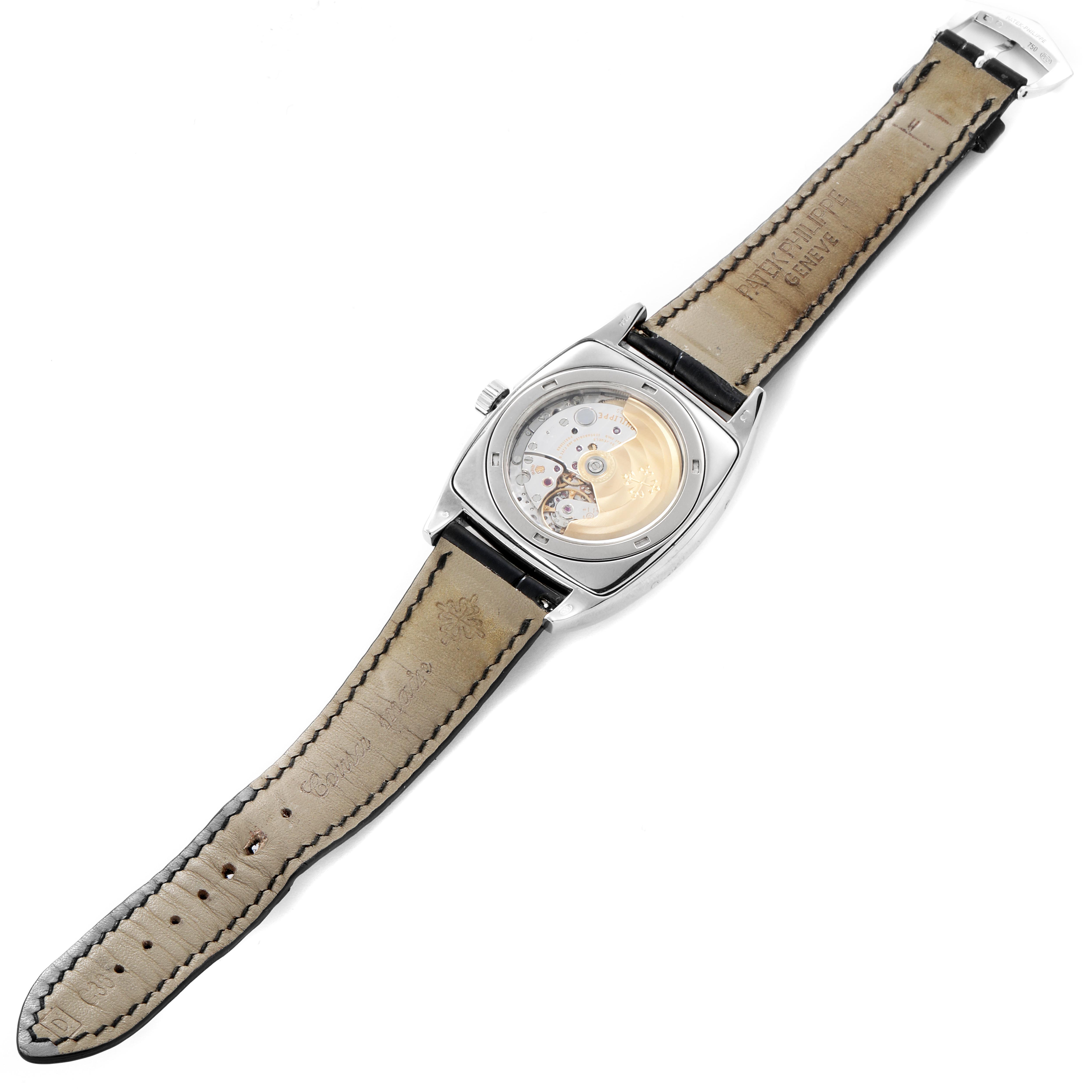 The Patek Philippe Gondolo 5135G-010 Men
s White Gold Grey Dial 5135G-010 Men
s White Gold Grey Dial watch is shown from the back, highlighting its transparent case back and visible movement.