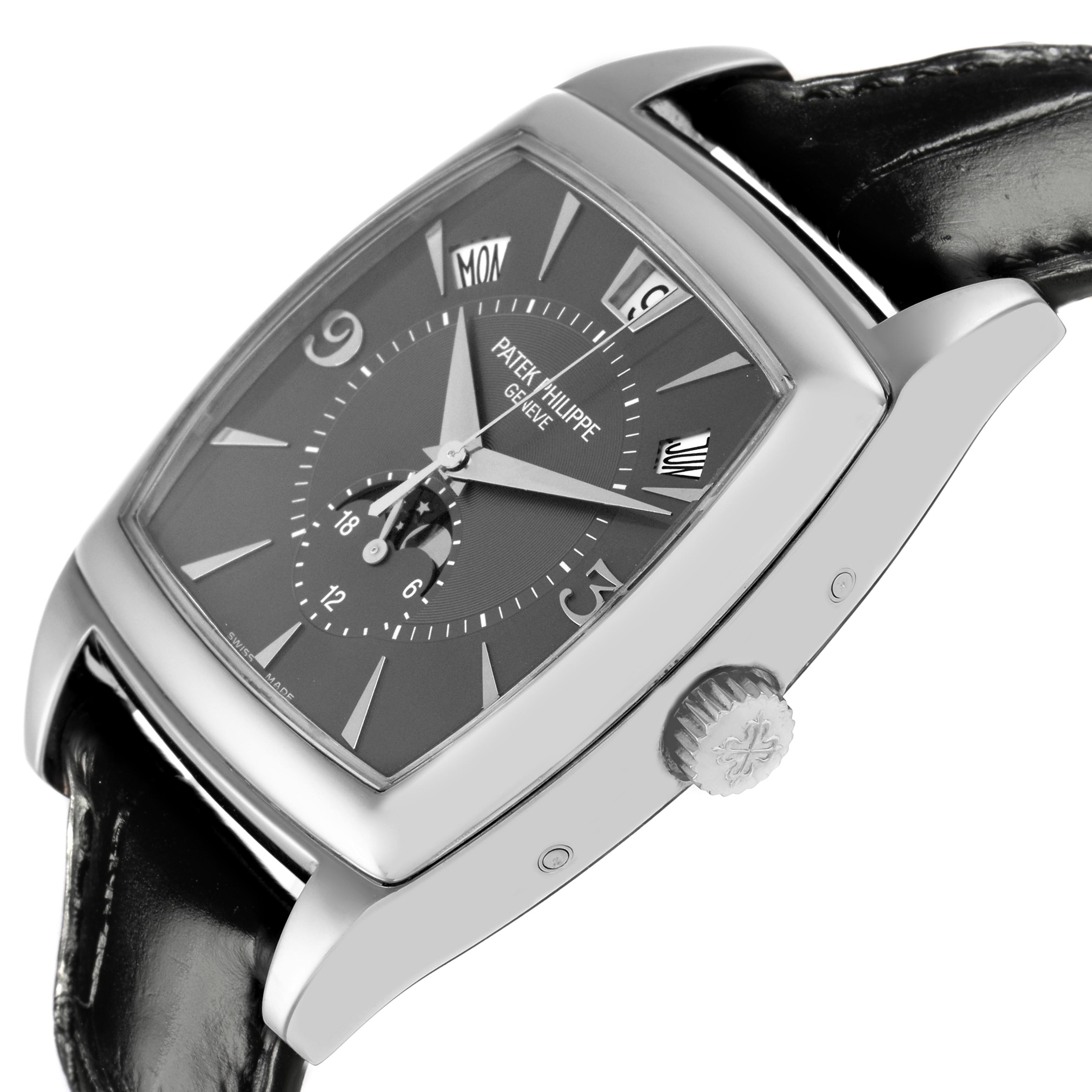 The Patek Philippe Gondolo 5135G-010 Men
s White Gold Grey Dial 5135G-010 Men
s White Gold Grey Dial watch is shown from a side angle, highlighting the case, dial, crown, and strap.