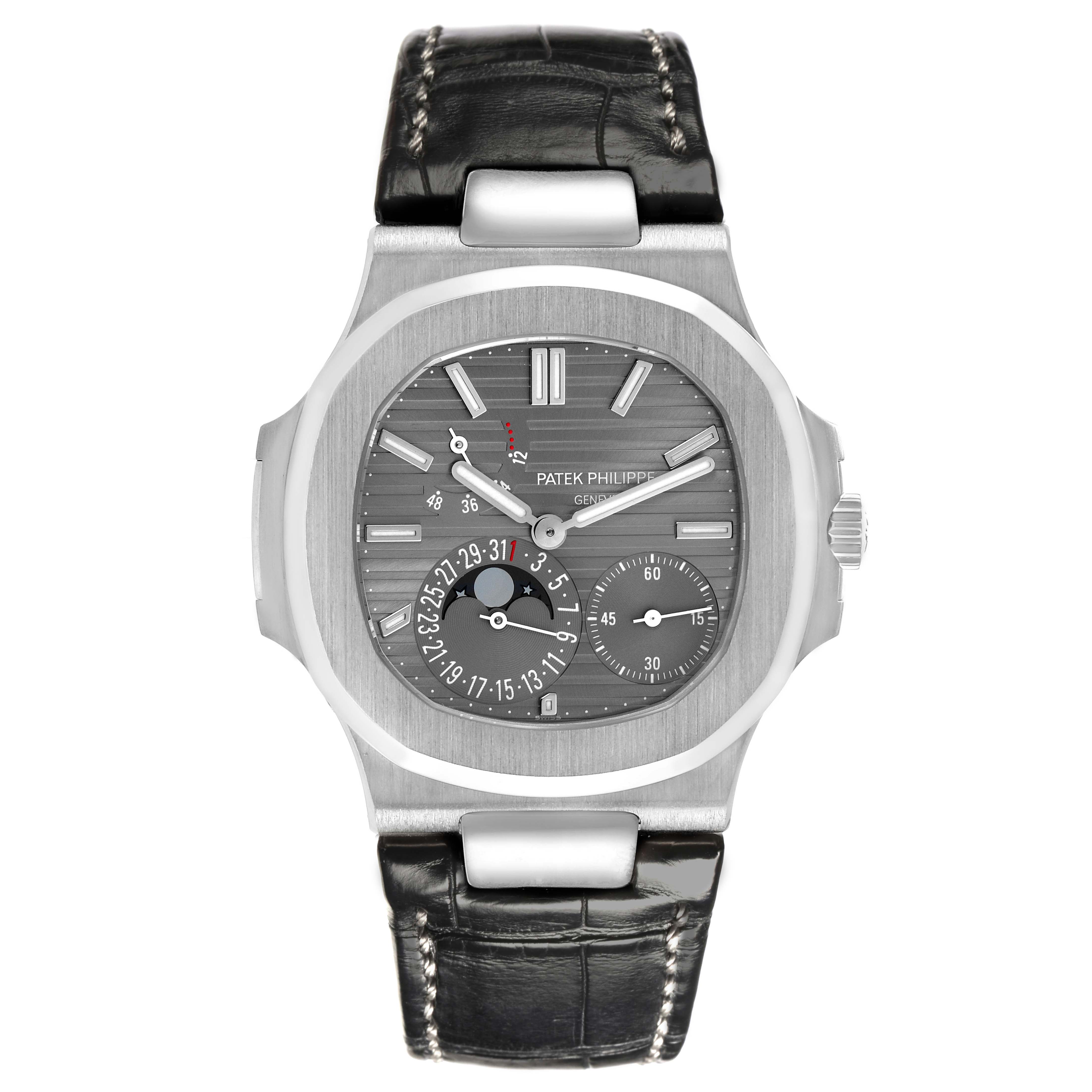 The image shows a front view of a Patek Philippe Nautilus 5712G-001 Men
s White Gold Grey Dial 5712G-001 Men
s White Gold Grey Dial watch, highlighting the face, subdials, case, and leather strap.