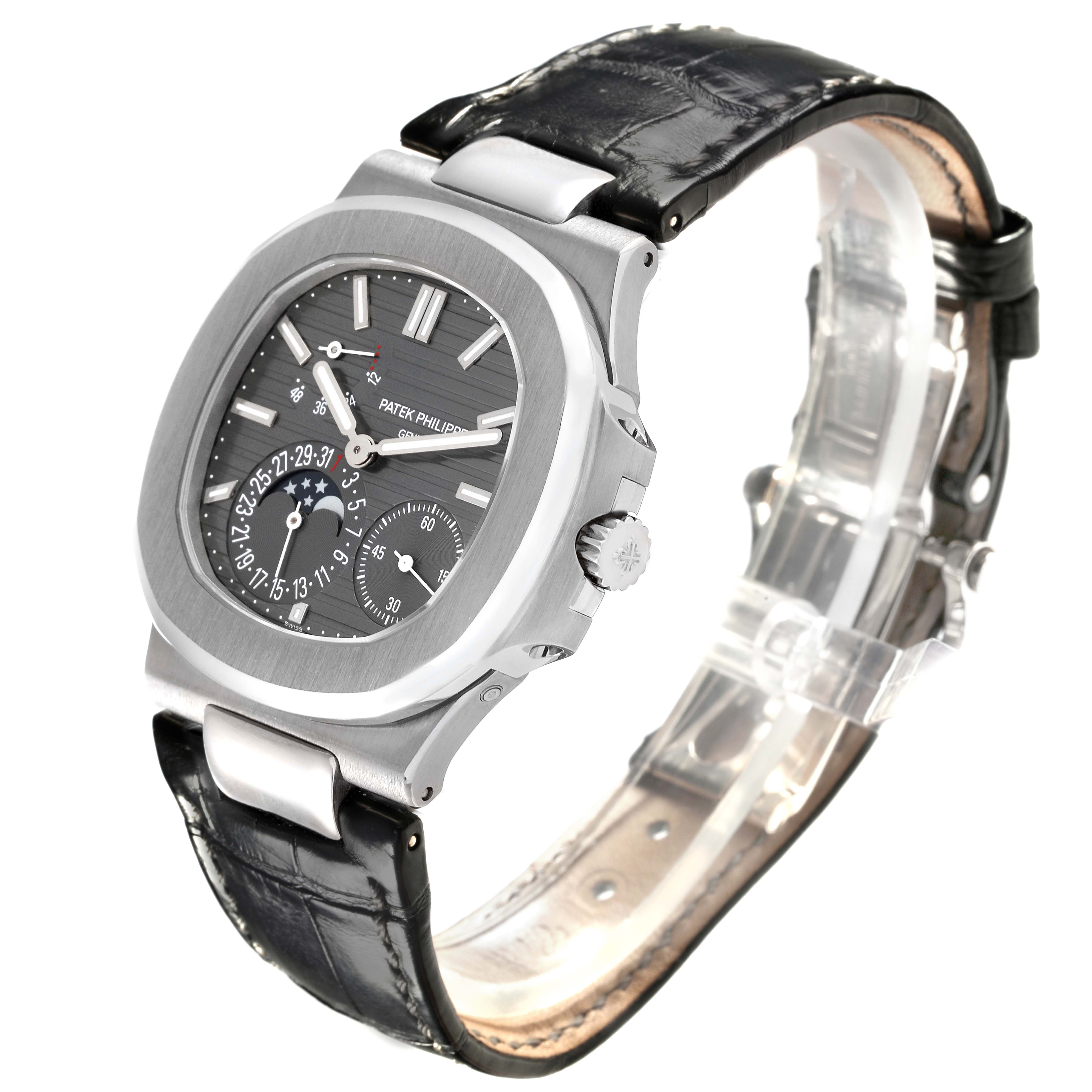 The Patek Philippe Nautilus 5712G-001 Men
s White Gold Grey Dial 5712G-001 Men
s White Gold Grey Dial watch is shown at a three-quarter angle, highlighting the dial, case, crown, and leather strap.