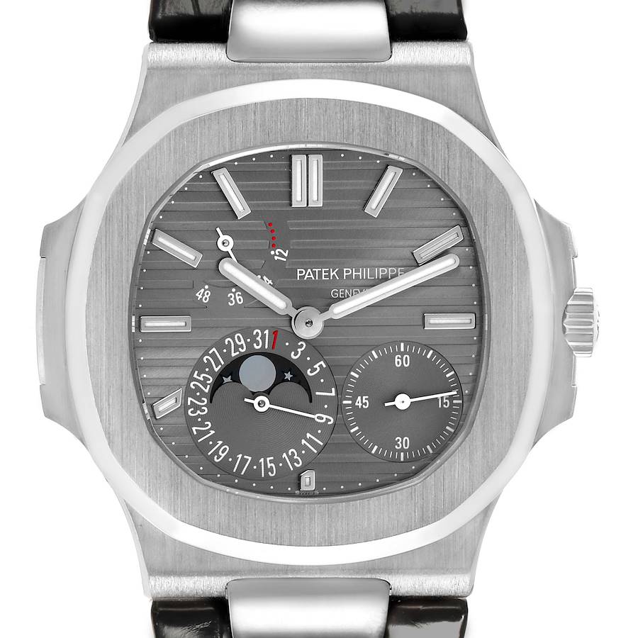 The Patek Philippe Nautilus watch is shown from a front angle, displaying the dial, hands, subdials, and bezel.