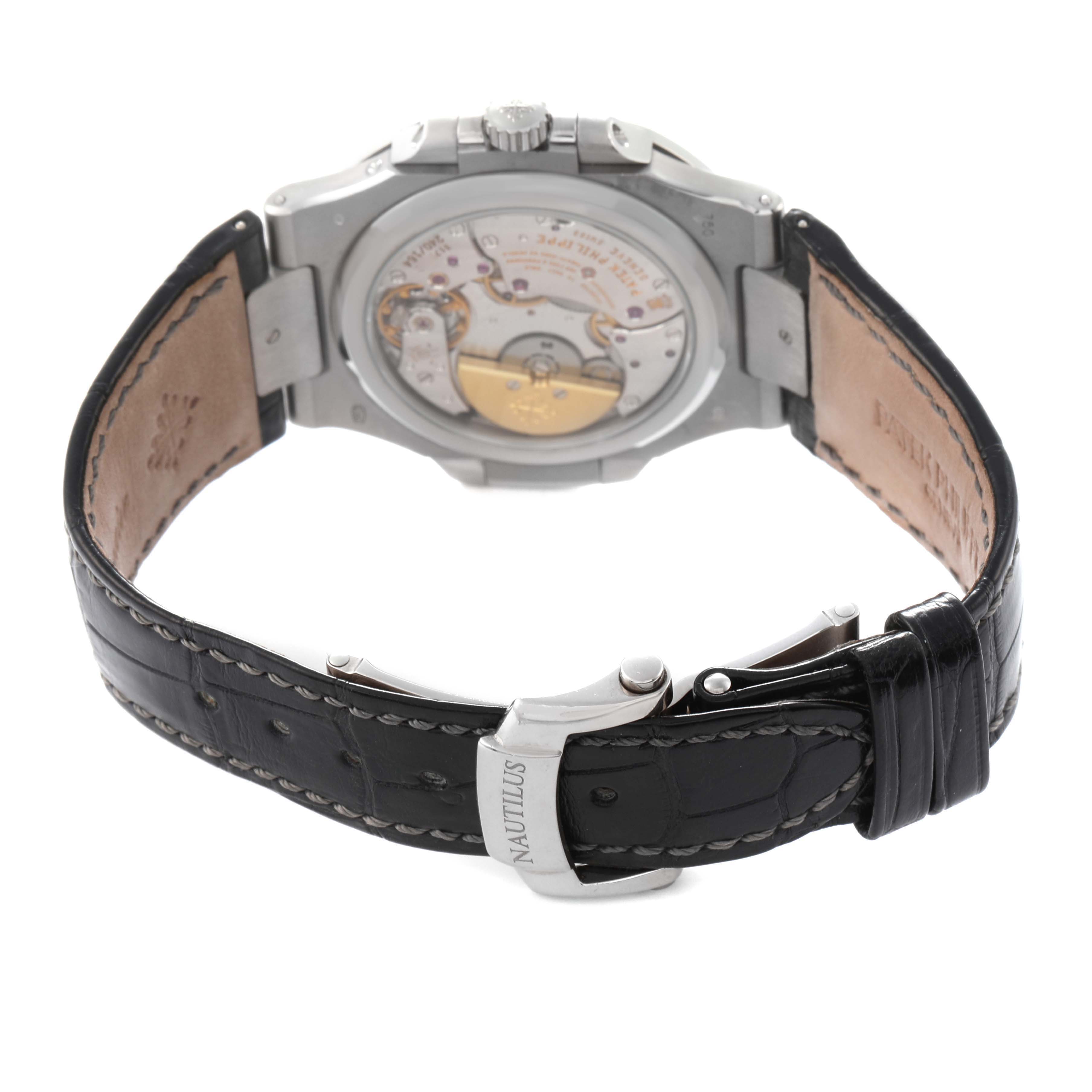 The image shows the back view of a Patek Philippe Nautilus 5712G-001 Men
s White Gold Grey Dial 5712G-001 Men
s White Gold Grey Dial watch, highlighting the case back and leather strap with a clasp.