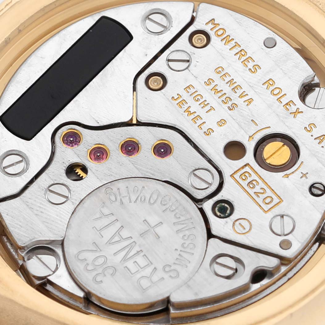 The image shows a close-up view of the internal mechanism of the Rolex Cellini 6621 Women's Yellow Gold White Dial 6621 Women's Yellow Gold White Dial watch, revealing its intricate components.