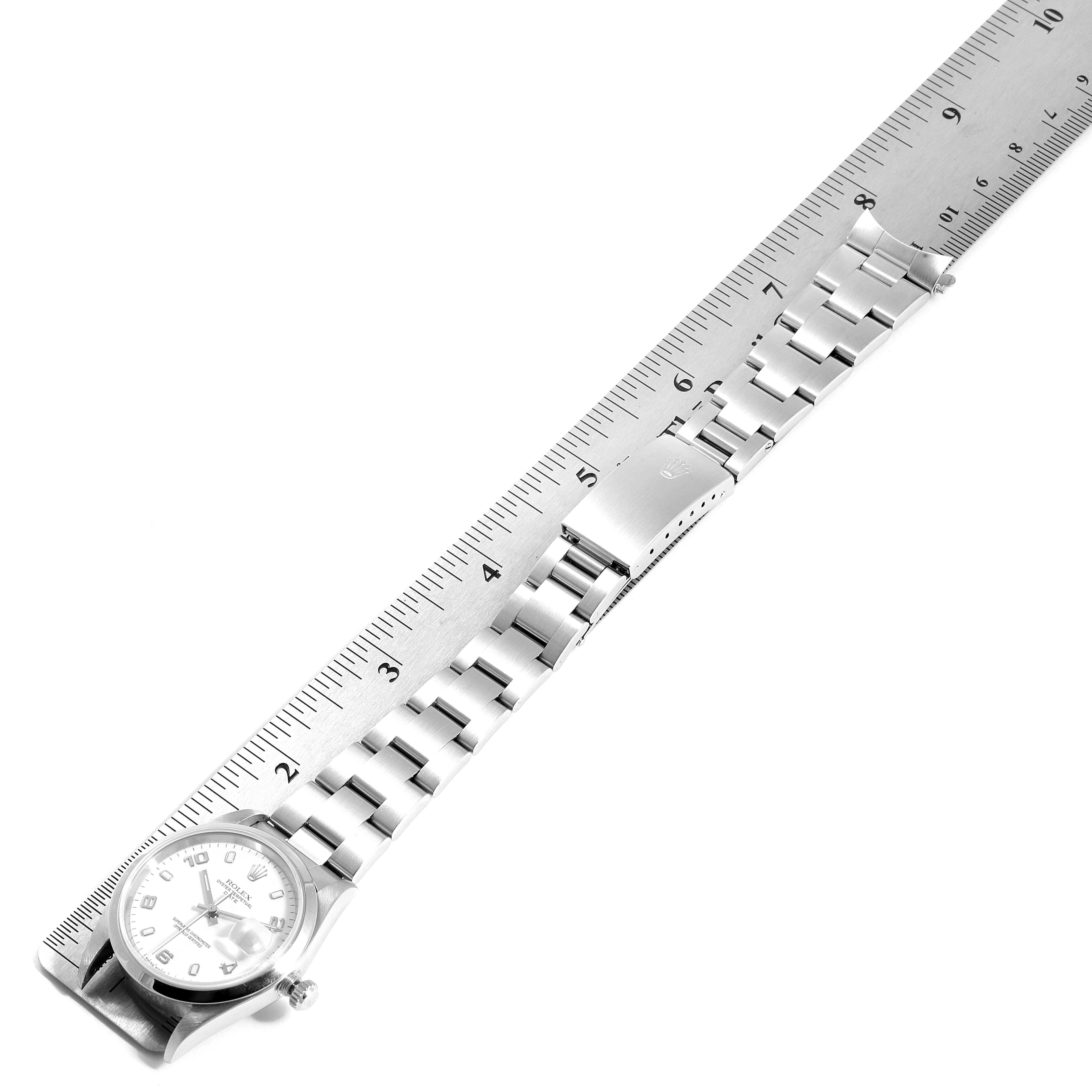 The image shows a Rolex Date 15200 Men's Stainless Steel White Dial 15200 Men's Stainless Steel White Dial model watch laid flat with a ruler, displaying the entire bracelet and watch face.