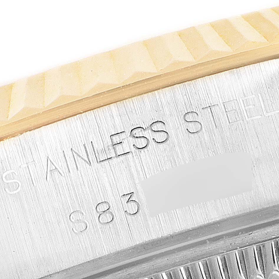 This close-up image shows the fluted bezel and part of the caseback engraving of a Rolex Datejust 69173 Women
s Steel and Gold (two tone) Champagne Dial 69173 Women
s Steel and Gold (two tone) Champagne Dial watch.