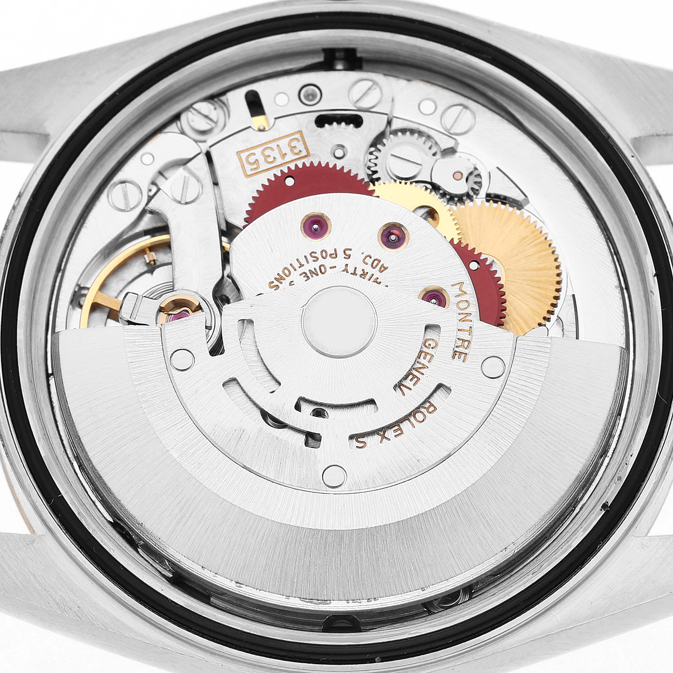 The image shows a close-up view of the movement mechanism inside a Rolex Datejust 16233 Men's Steel and Gold (two tone) Champagne Dial watch.