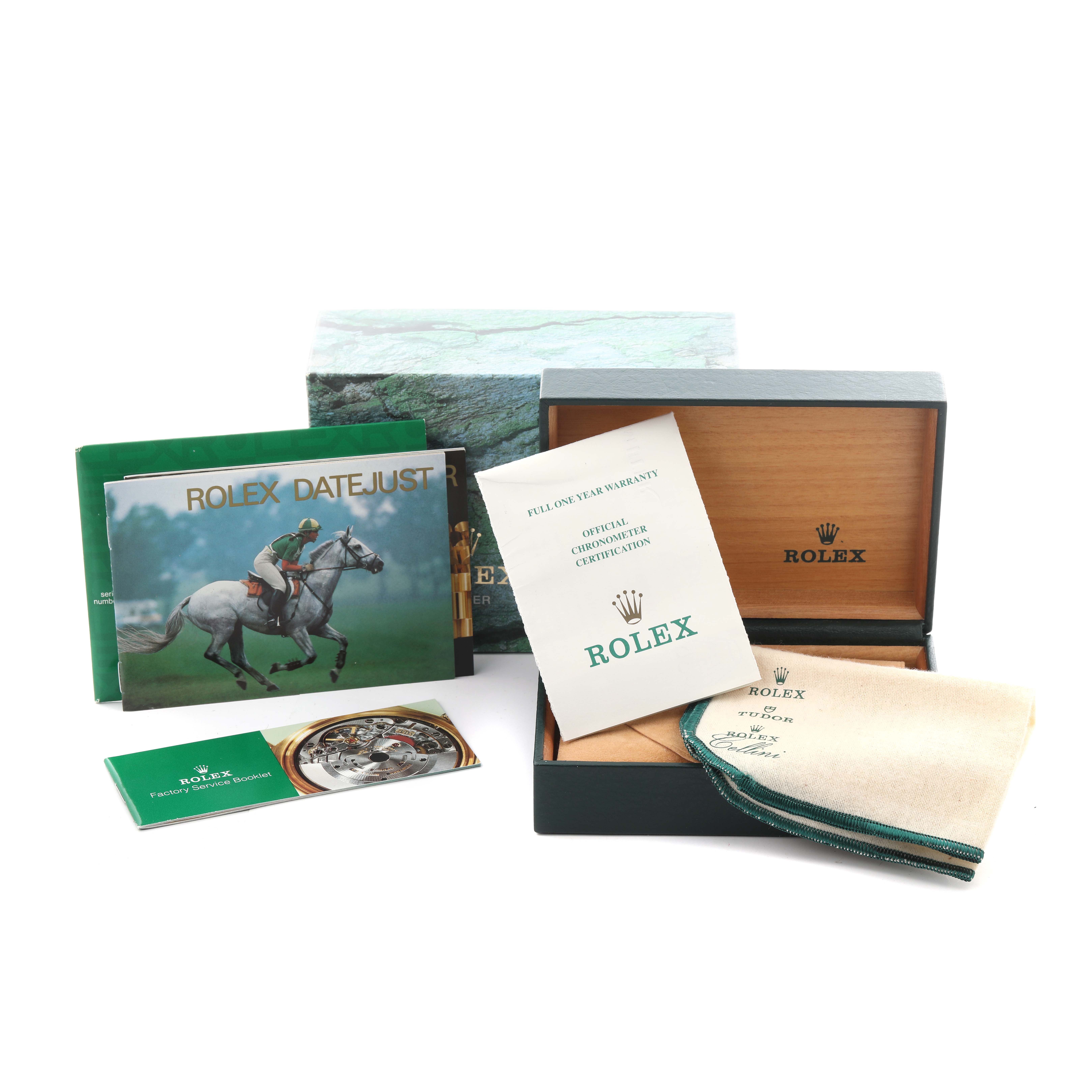 The image shows a Rolex Datejust 16233 Men's Steel and Gold (two tone) Champagne Dial 16233 Men's Steel and Gold (two tone) Champagne Dial box with manuals, a warranty card, and a cleaning cloth from a slightly above angle.