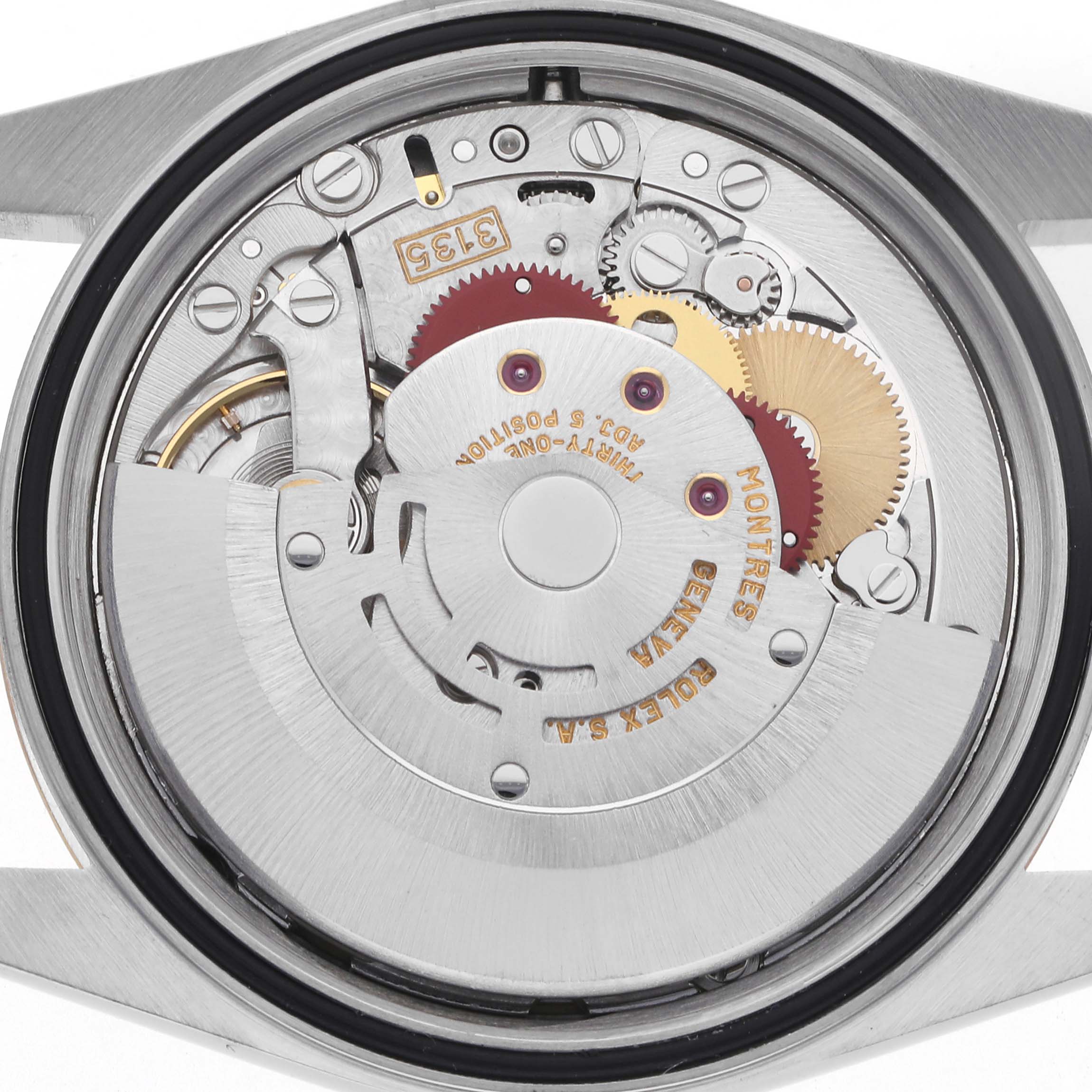 The image shows the movement of a Rolex Datejust 16233 Men's Steel and Gold (two tone) Champagne Dial 16233 Men's Steel and Gold (two tone) Champagne Dial watch, viewed from the back, highlighting gears and the rotor.