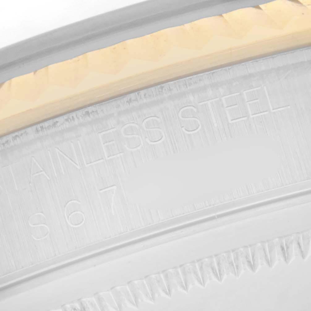 The image shows a close-up of the case back of a Rolex Datejust 16233 Men
s Steel and Gold (two tone) White Dial 16233 Men
s Steel and Gold (two tone) White Dial, revealing the bezel edge and "STAINLESS STEEL" engraving.