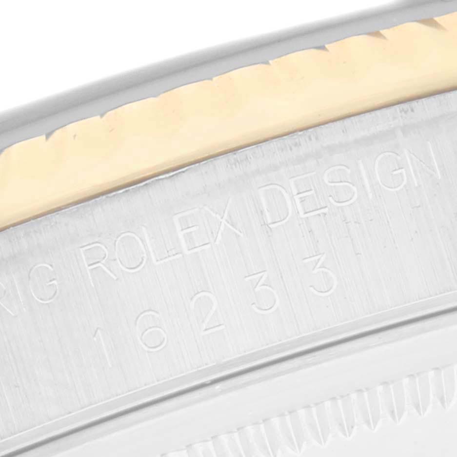 The image shows a close-up of the side case details on a Rolex Datejust 16233 Men
s Steel and Gold (two tone) White Dial 16233 Men
s Steel and Gold (two tone) White Dial, highlighting the engraved model number.