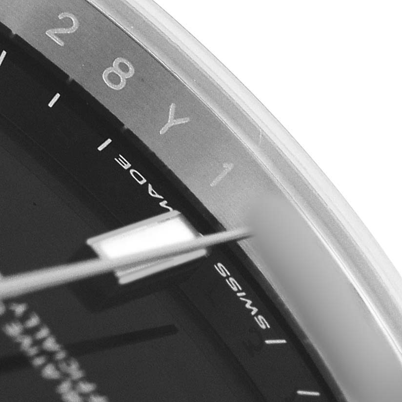 The image shows a close-up of the dial of the Rolex Datejust 41 126300 Mens Stainless Steel Black Dial, focusing on the edge with partial numerals and "SWISS MADE" text.
