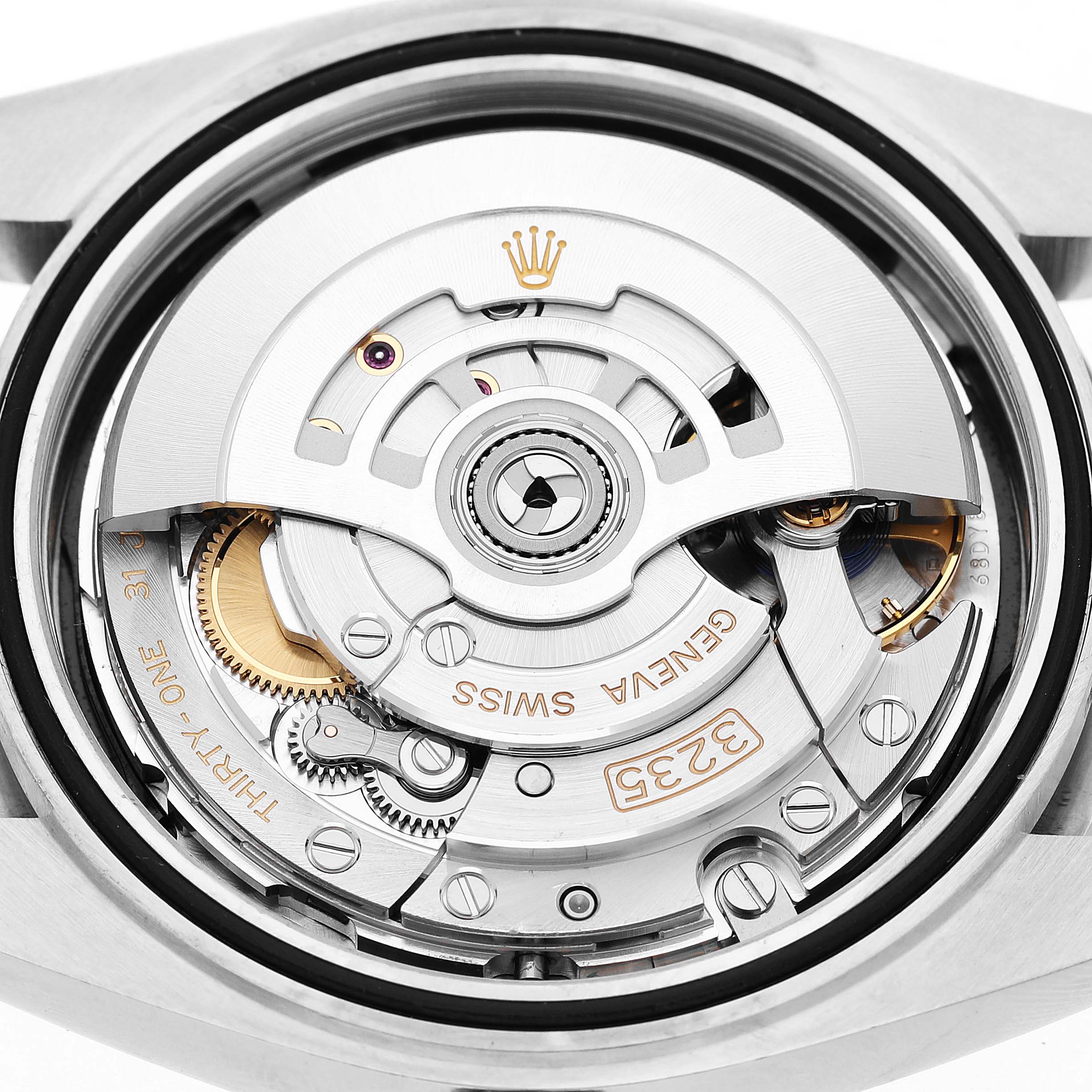 The image shows the movement of the Rolex Datejust 41 126300 Mens Stainless Steel Black Dial from a back angle, highlighting its intricate mechanics and rotor.
