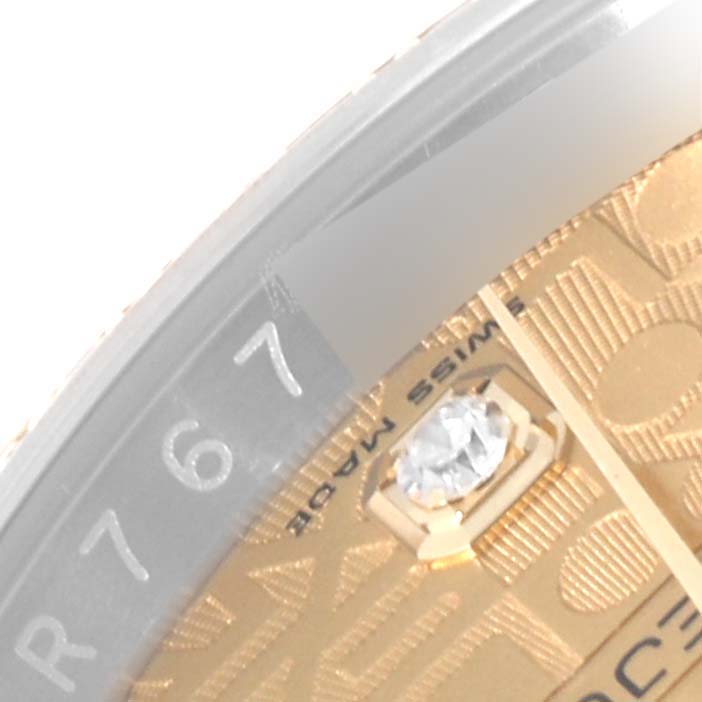 The image shows a close-up angle of the Rolex Datejust 116243 Men's Steel and Gold (two tone) Champagne Dial 116243 Men's Steel and Gold (two tone) Champagne Dial watch, highlighting part of the dial and the "Swiss Made" text.