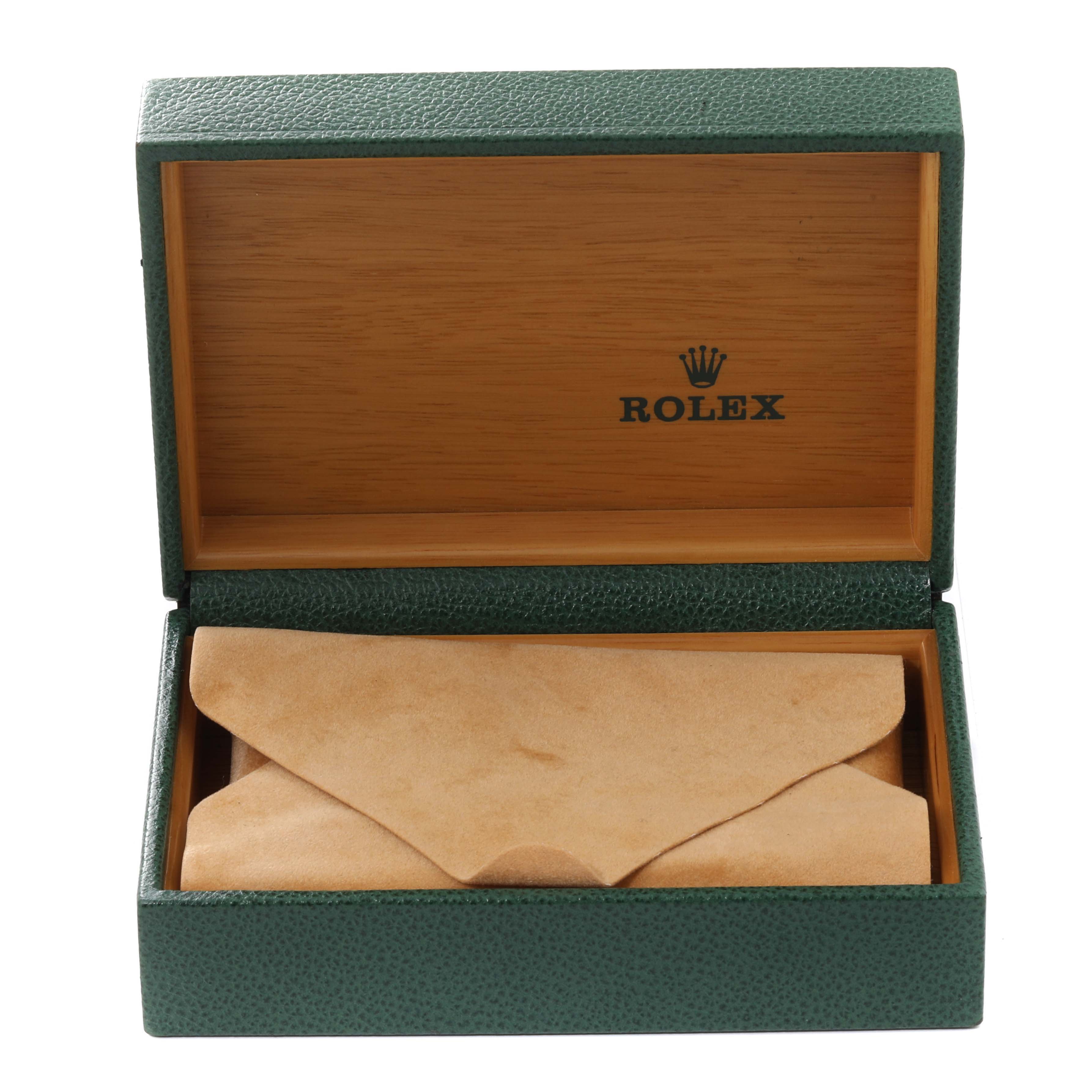 The image shows an open Rolex Datejust 16233 Men
s Steel and Gold (two tone) White Dial 16233 Men
s Steel and Gold (two tone) White Dial box with a leather pouch inside, viewed from the front.