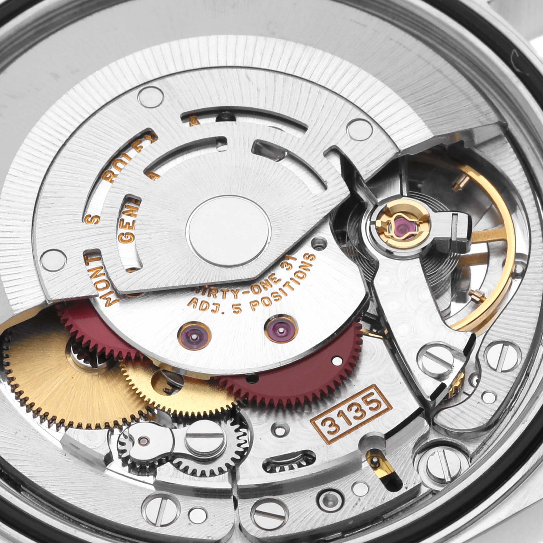 The image shows the intricate internal mechanism of the Rolex Datejust 16233 Men
s Steel and Gold (two tone) White Dial 16233 Men
s Steel and Gold (two tone) White Dial 3135 movement from a close-up angle.