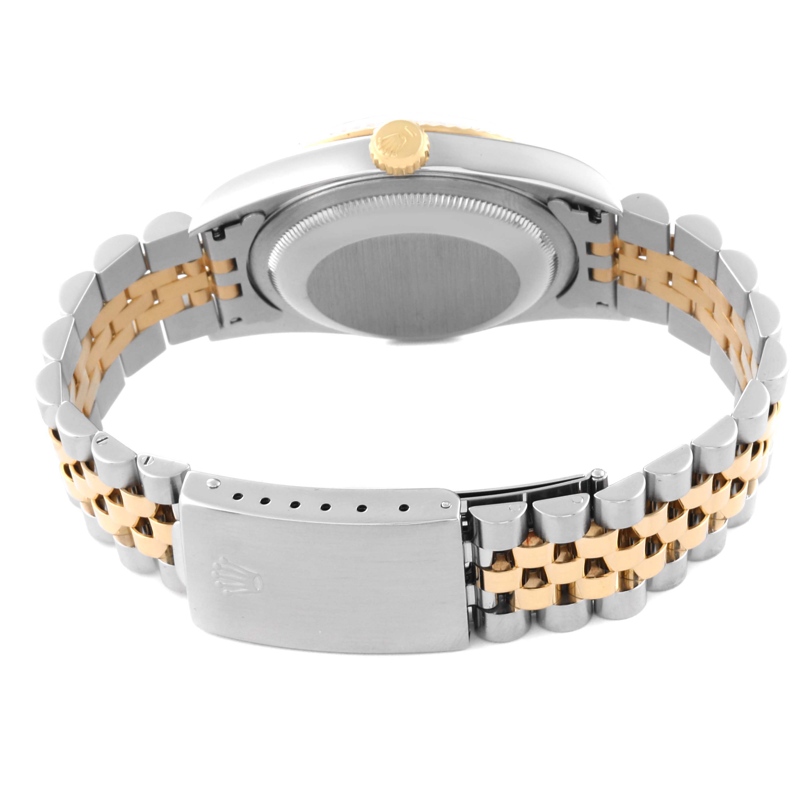 The image shows the back and side view of the Rolex Datejust 16233 Men
s Steel and Gold (two tone) White Dial 16233 Men
s Steel and Gold (two tone) White Dial watch, highlighting its two-tone bracelet and clasp.