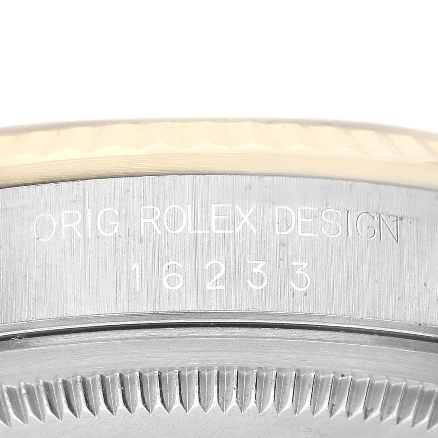 This image shows a close-up of the bezel and case side of a Rolex Datejust 16233 Men's Steel and Gold (two tone) White Dial 16233 Men's Steel and Gold (two tone) White Dial watch, displaying the model number 16233 and engraving.