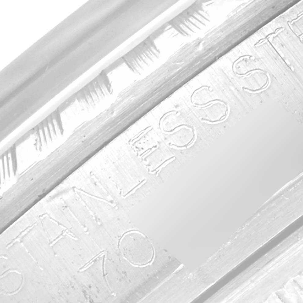 The image shows a close-up of the stainless steel rim of the Vintage Collection model by Rolex, highlighting the engraved text.