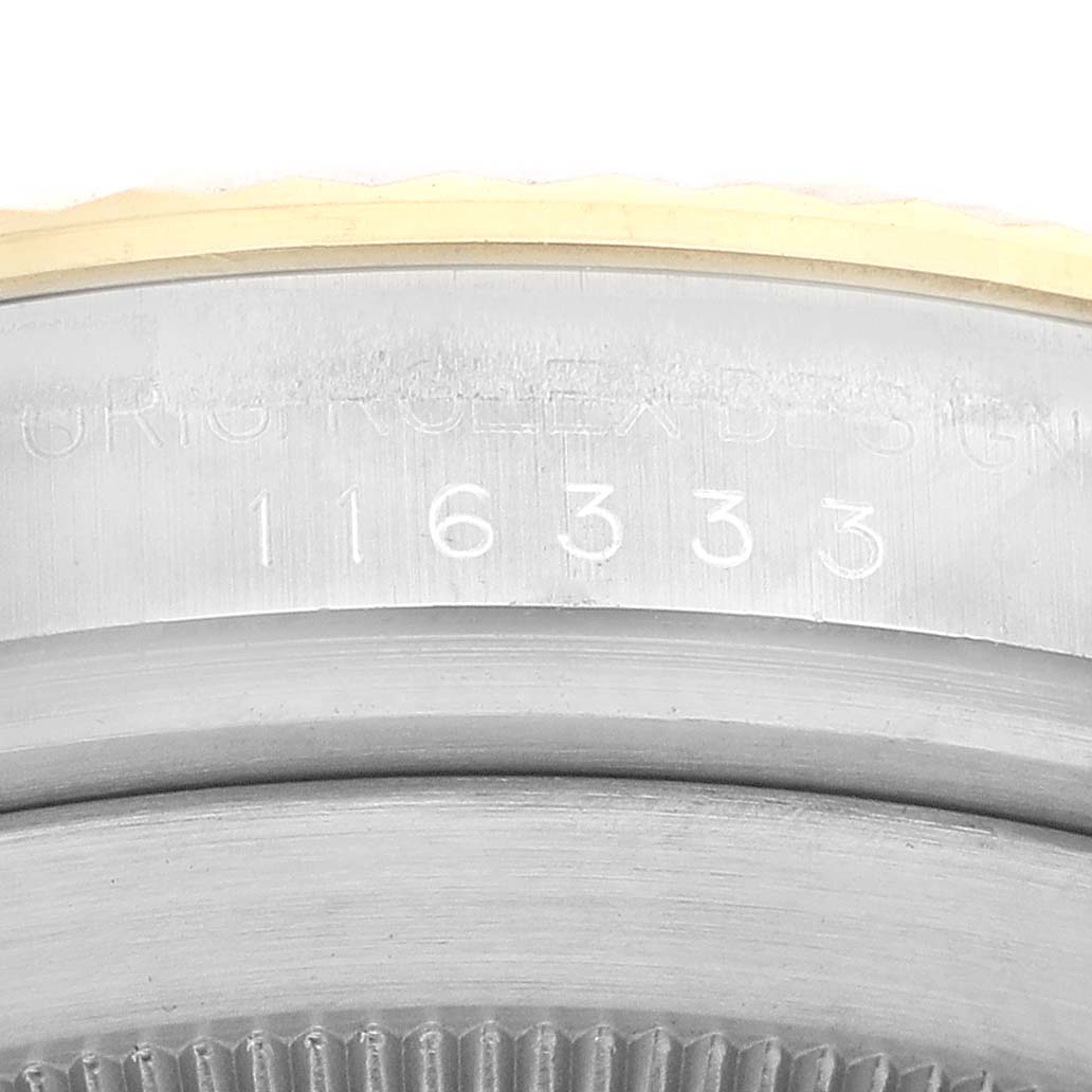 The image shows a close-up of the case side of a Rolex Datejust 41 116333 Men's Steel and Gold (two tone) Champagne Dial 116333 Men's Steel and Gold (two tone) Champagne Dial, highlighting the model and serial number engraved on it.