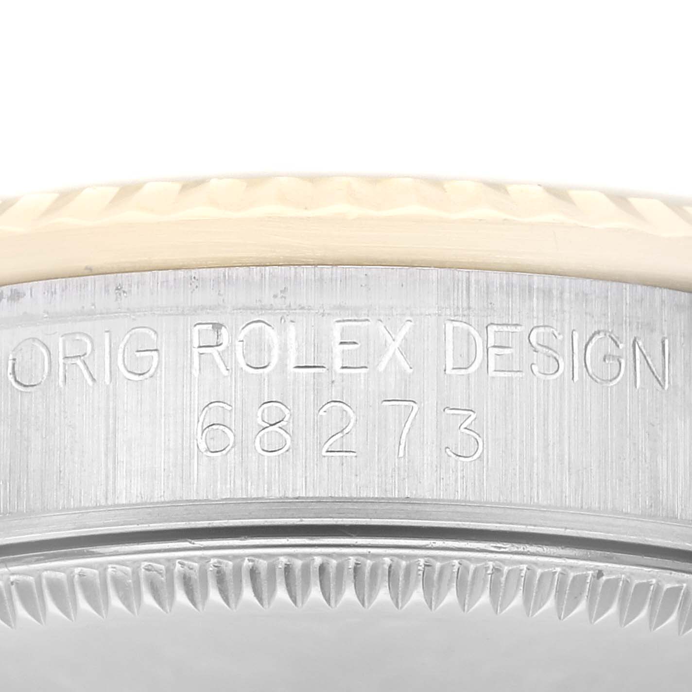 The image shows a close-up of the side of a Mid-Size Rolex watch, displaying the model number and "ORIG ROLEX DESIGN" engraving.